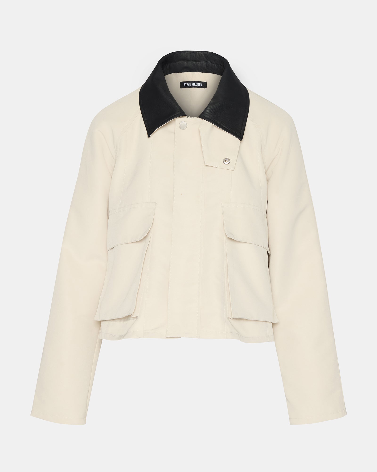 Woman pairing the oatmeal jacket with casual attire for a stylish daytime look