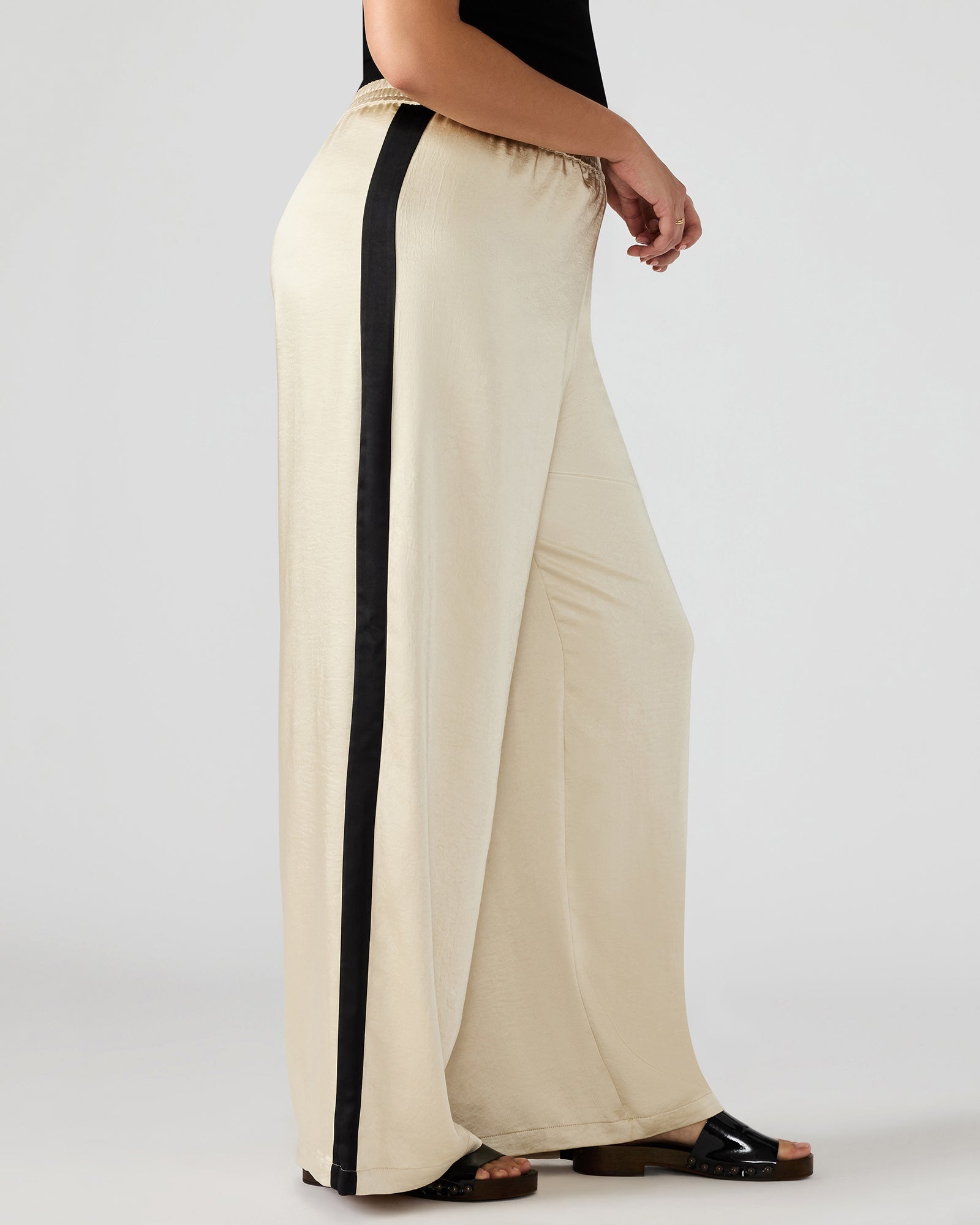 Side view of womens golf pants highlighting the elastic waistband.
