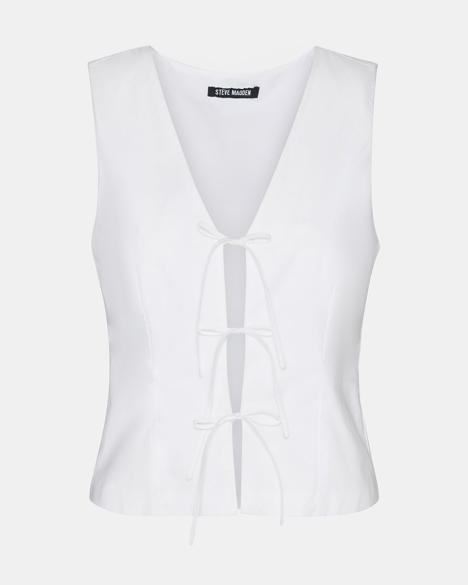 Aliza white tie-front top styled with high-waisted trousers for office wear