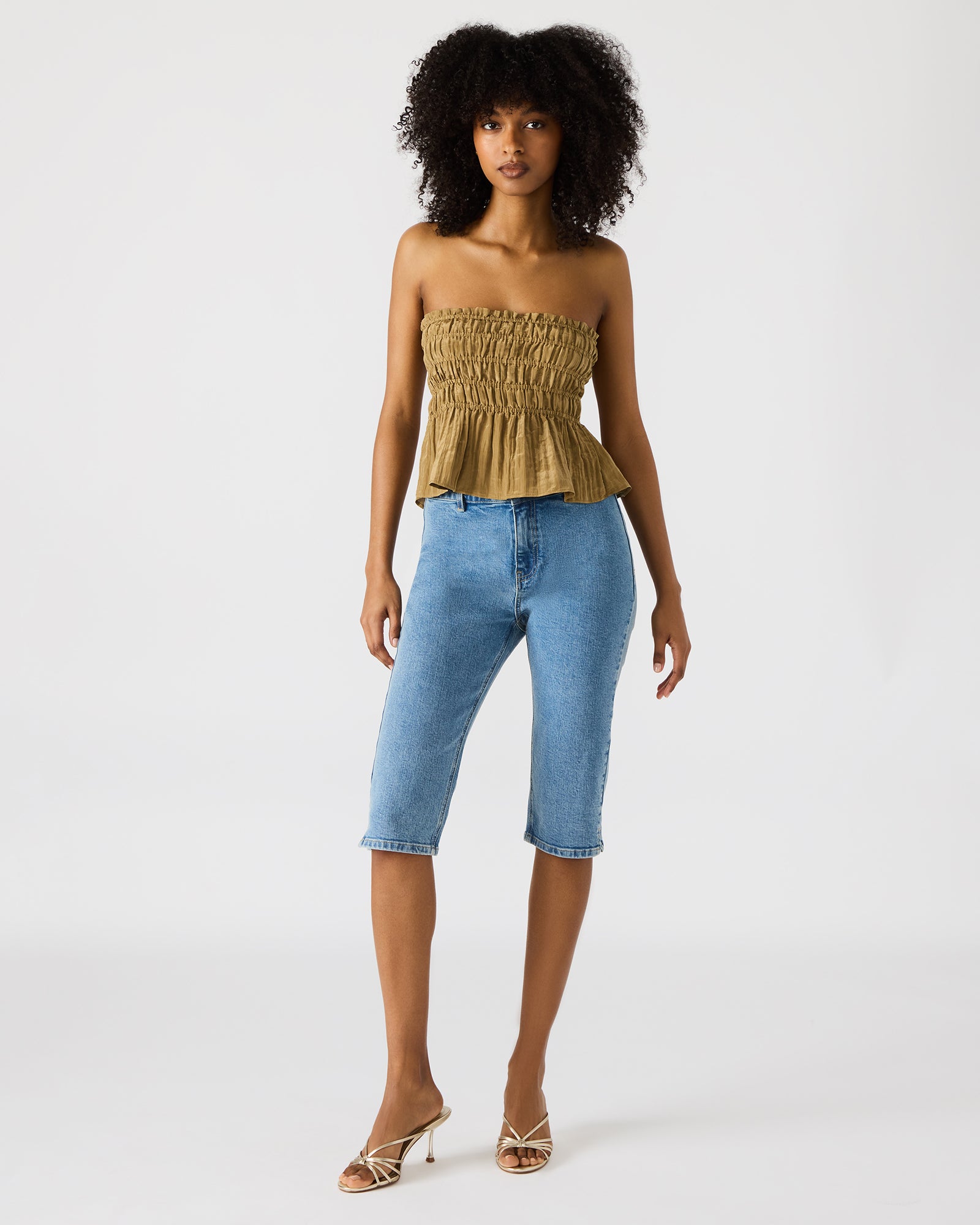 Front view of the olive green strapless ruched top with peplum detail