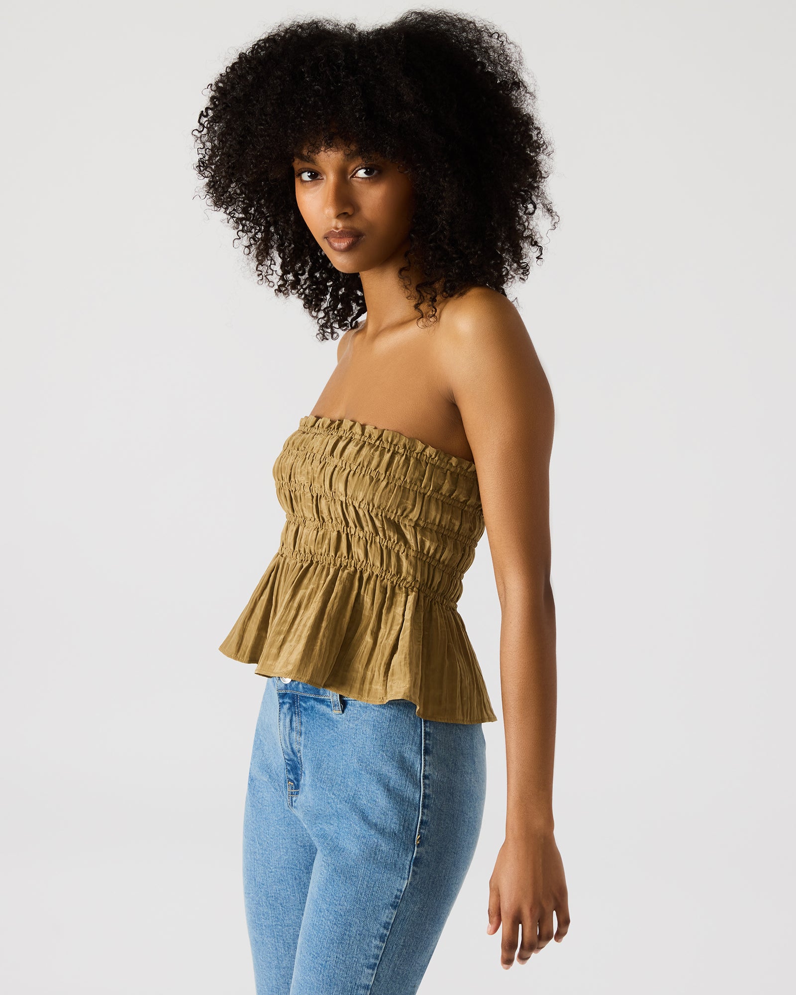 Close-up of the ruched fabric and strapless design for a chic look
