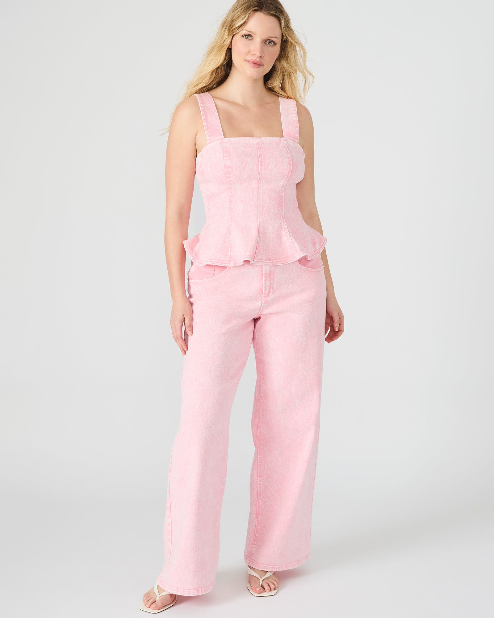 Close-up of Roz wide leg denim pant with functional pockets.