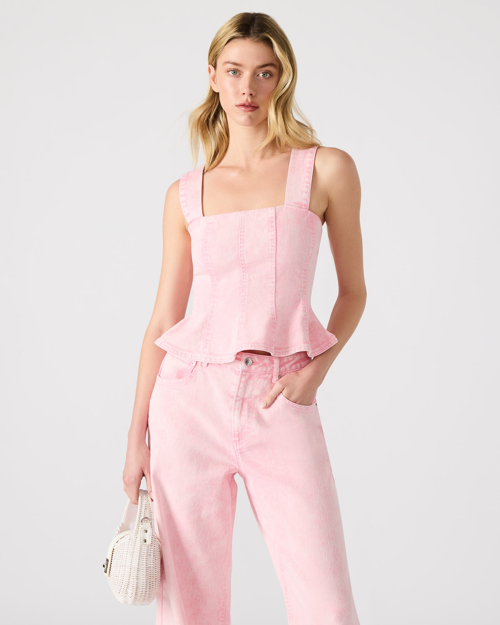Close-up of the fabric texture of the pink denim corset top
