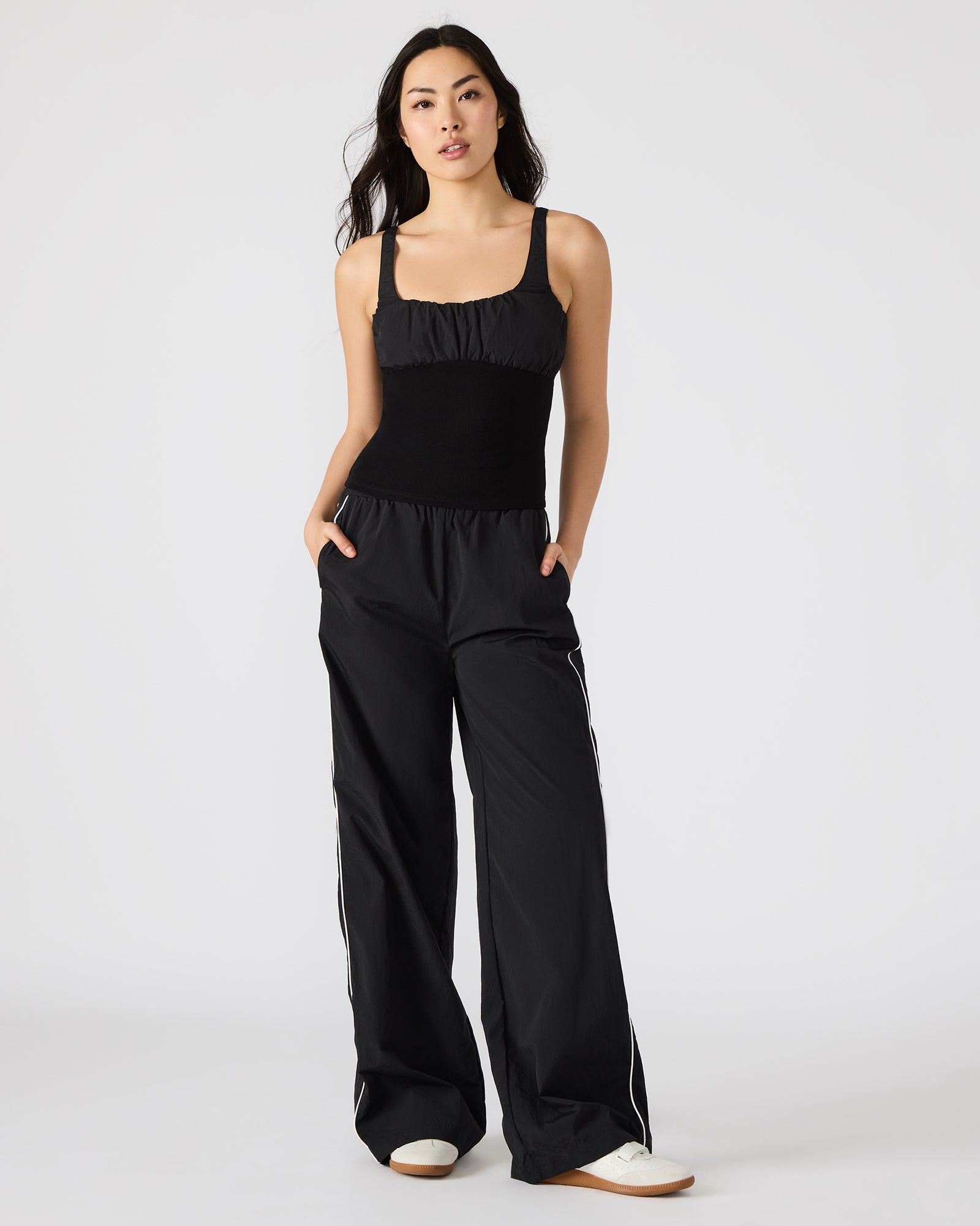 Close-up of LUANA black tank top’s ruched detailing