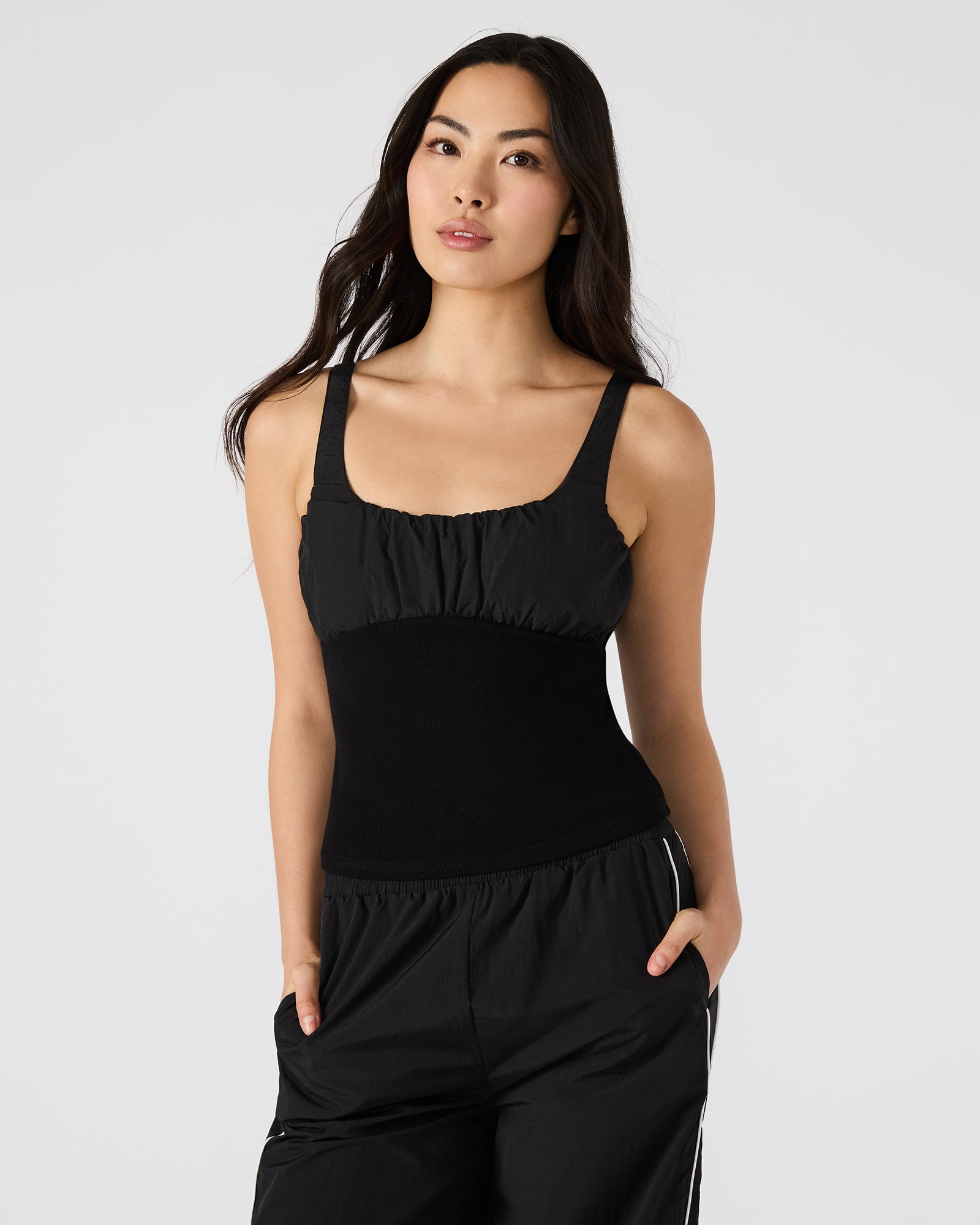Women’s tank top paired with denim shorts for a casual look