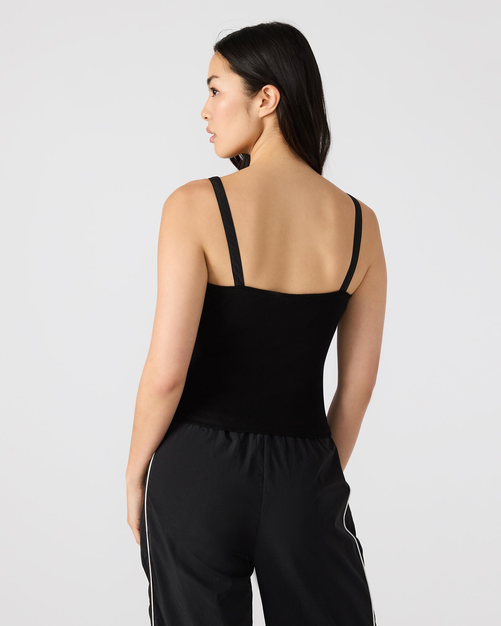 Close-up of LUANA black tank top’s ruched detailing