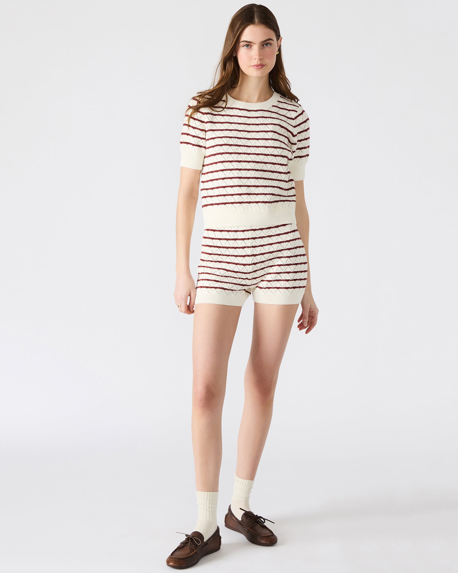 Side view of Norris Cream Knit Top showcasing its stylish striped pattern.