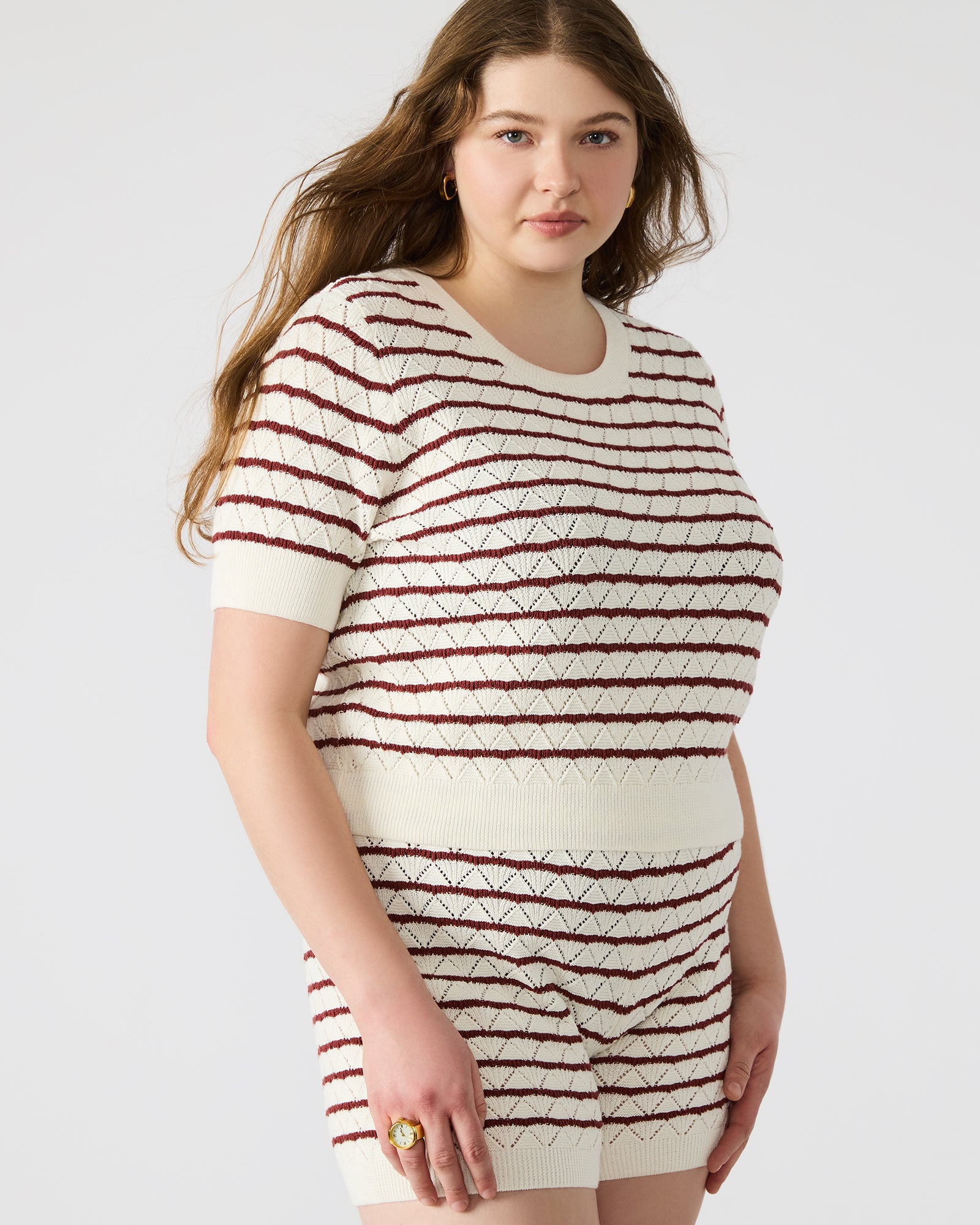 Side view of Norris Cream Knit Top showcasing its stylish striped pattern.