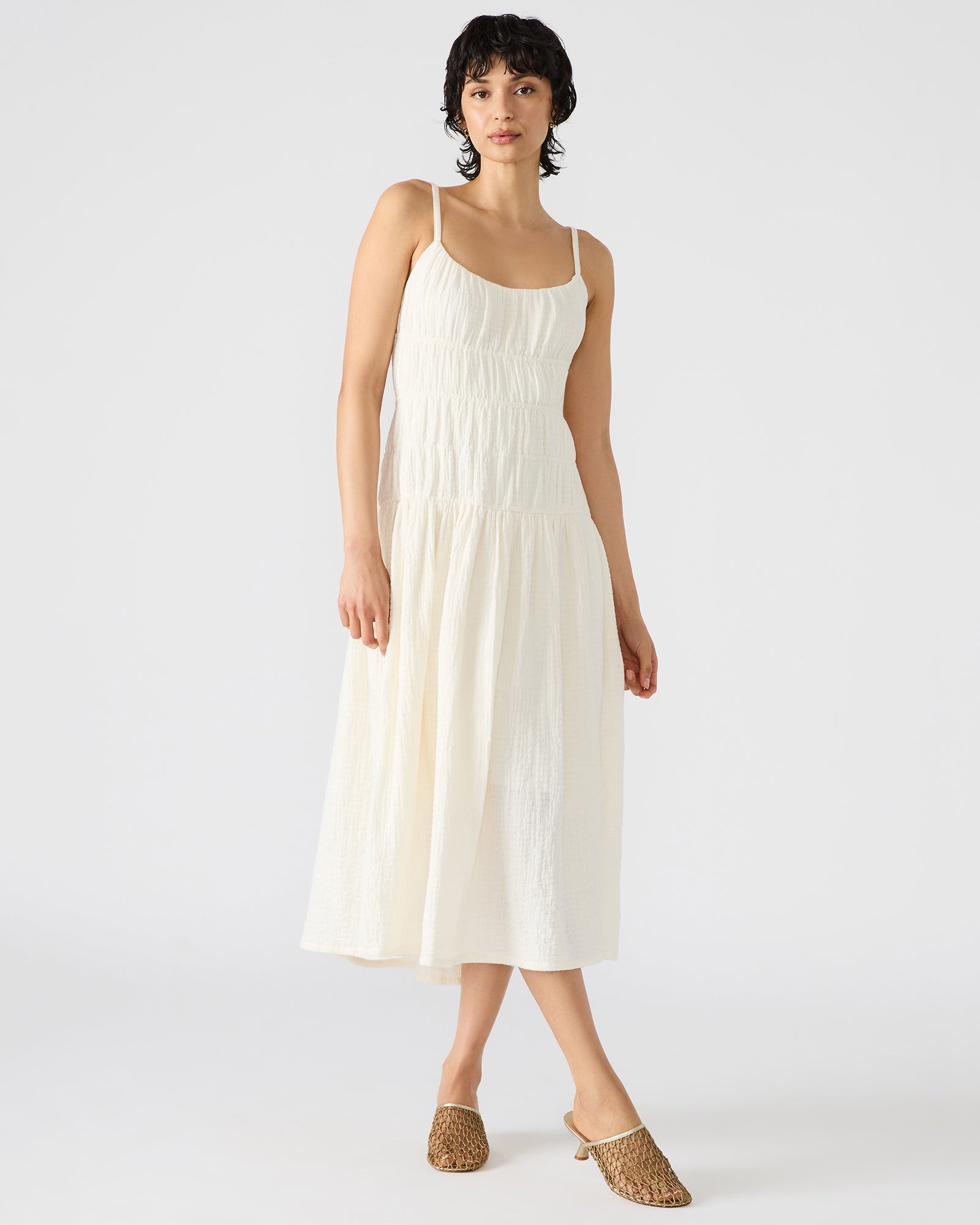 Front view of white maxi dress on model outdoors near Lake Michigan