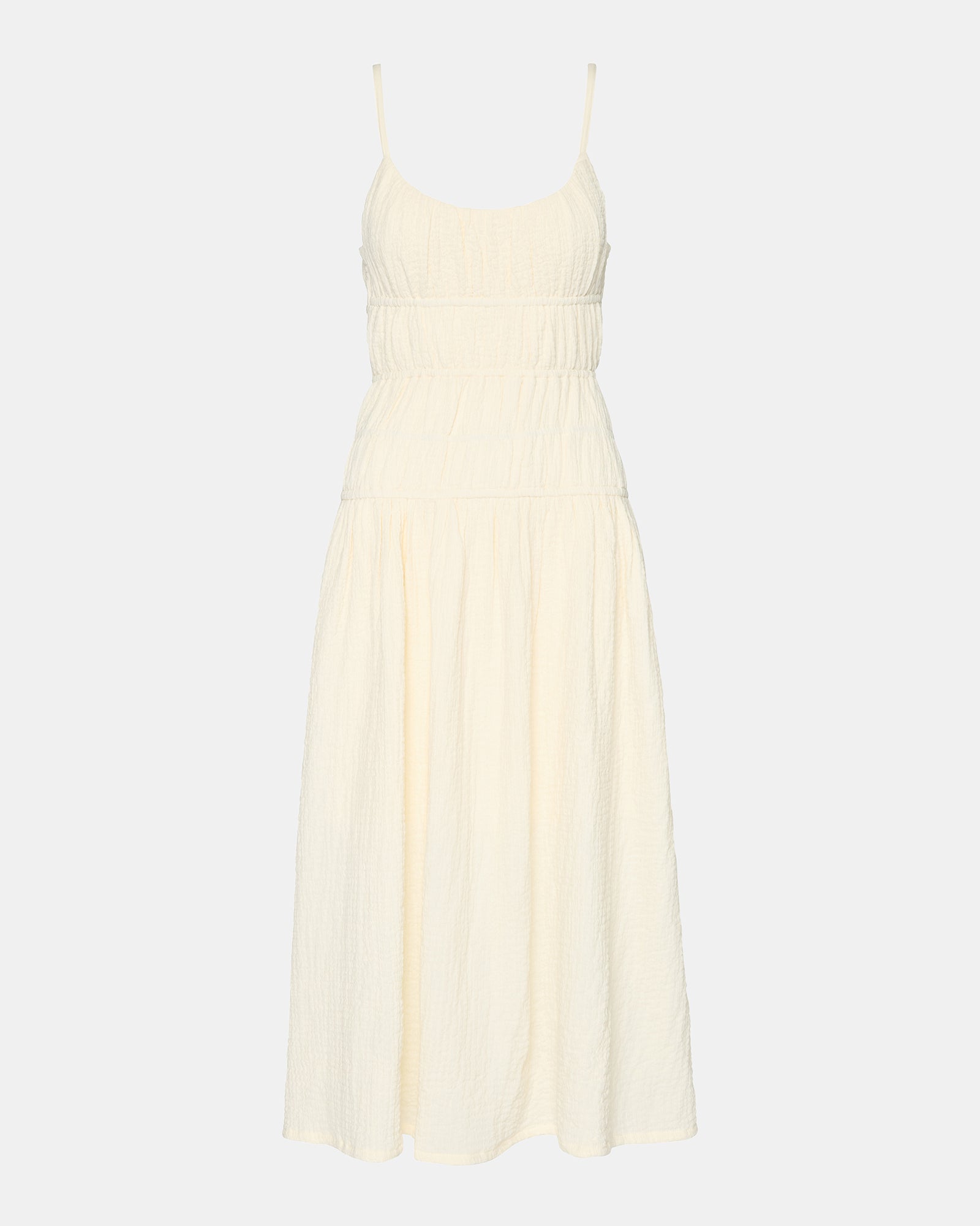 Front view of white maxi dress on model outdoors near Lake Michigan