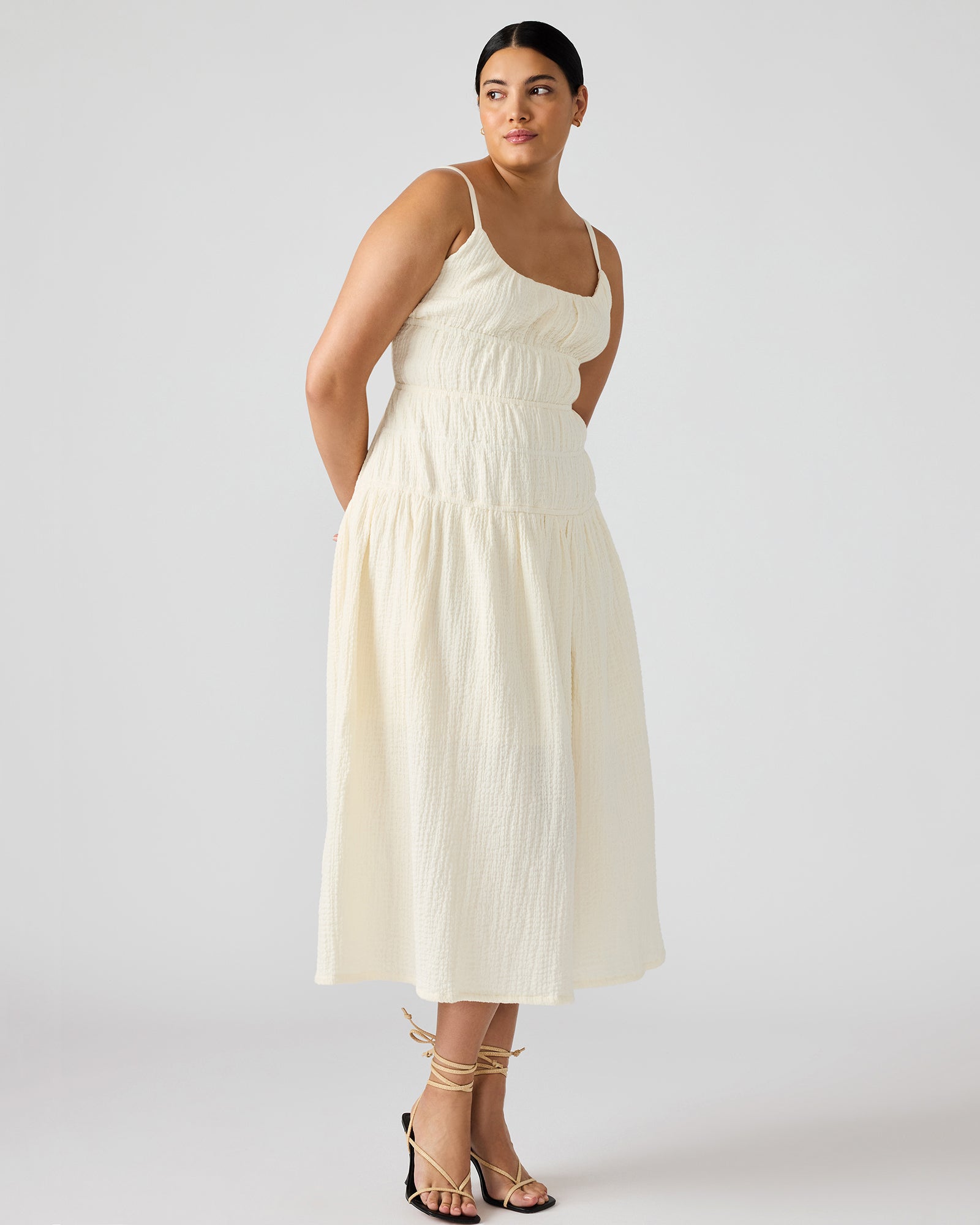 Side profile of maxi dress in motion, ideal for weekend city outings