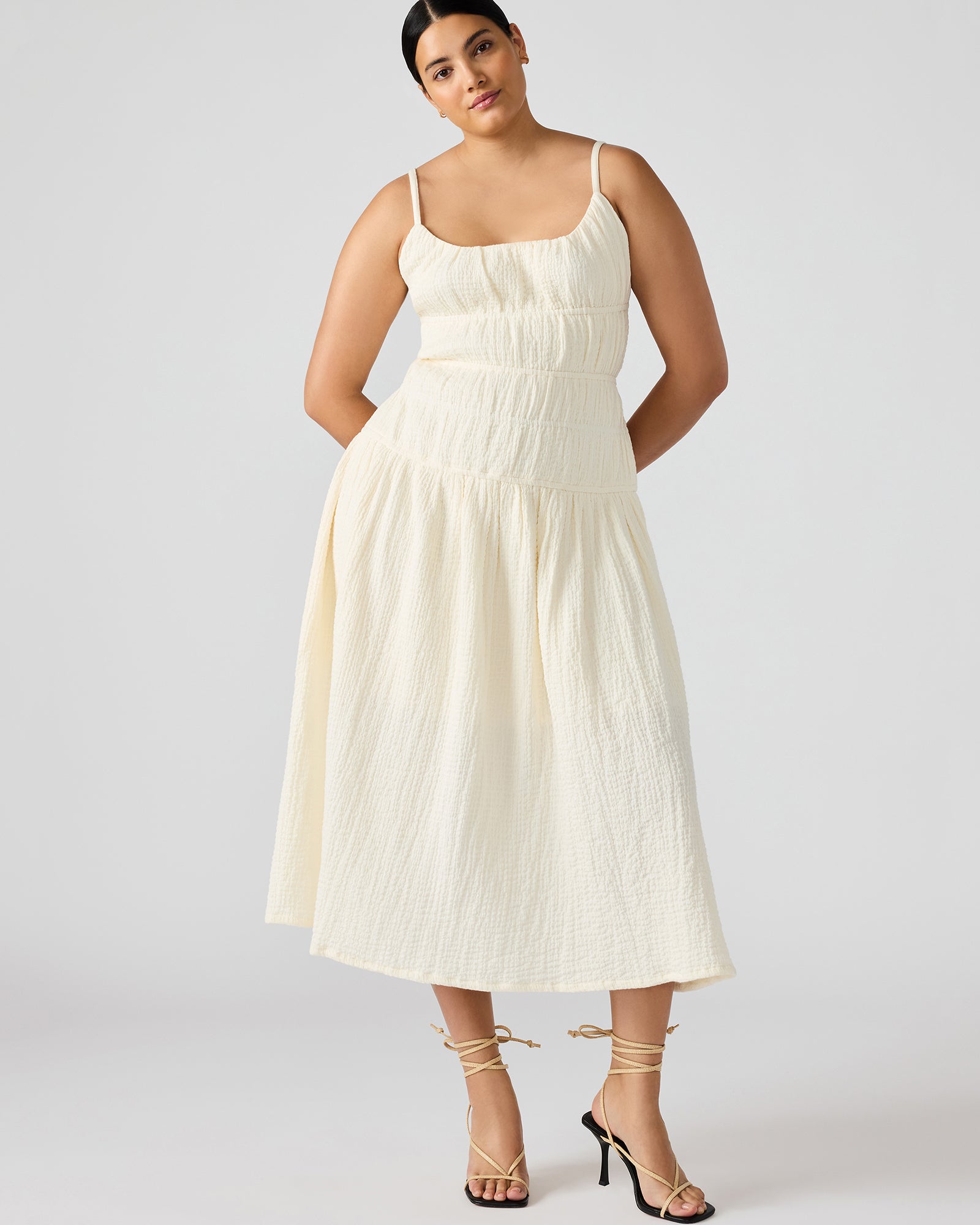 Back angle showing bow tie detail on flowy cotton dress