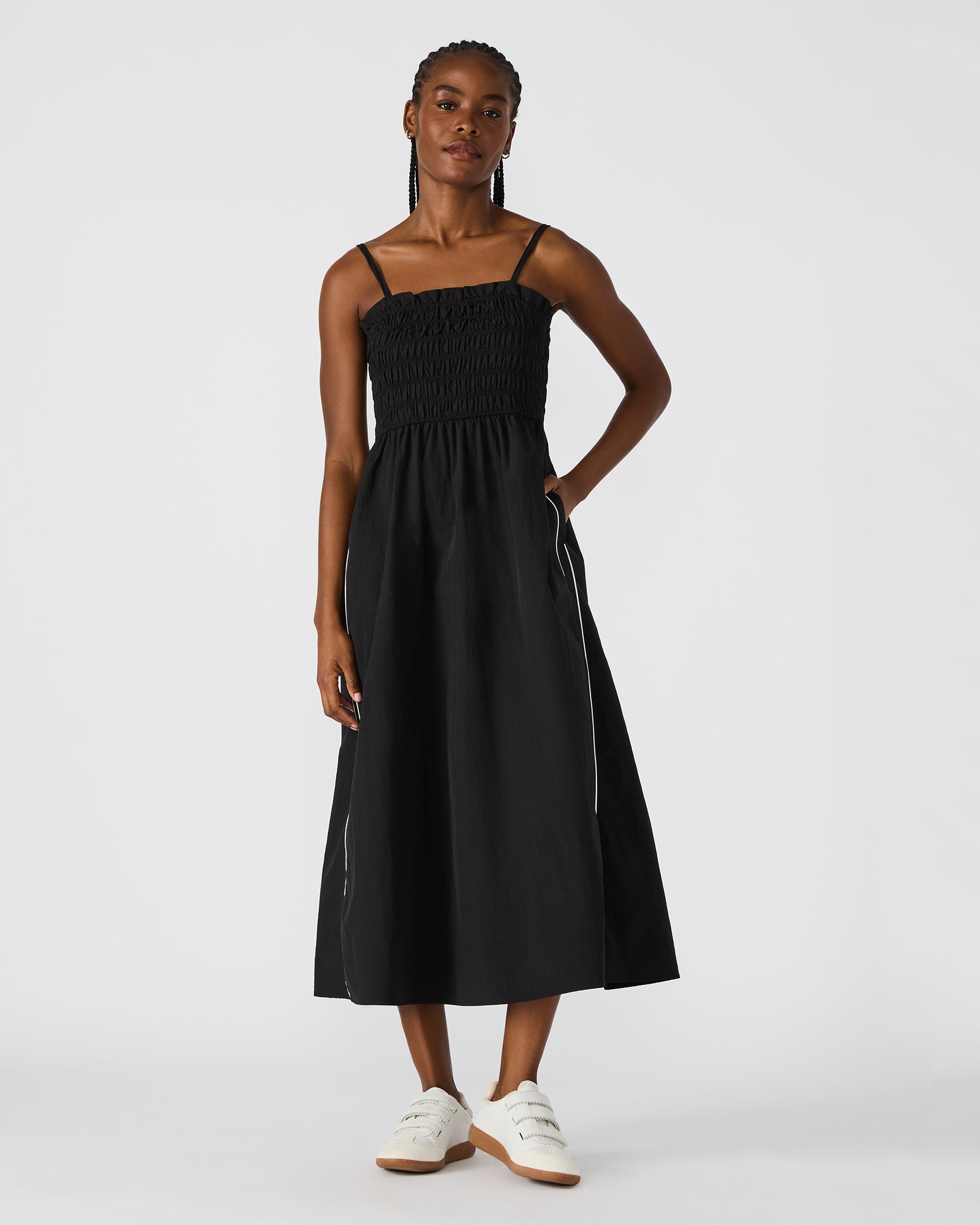 Side view of the flowy maxi dress with stripe detailing.