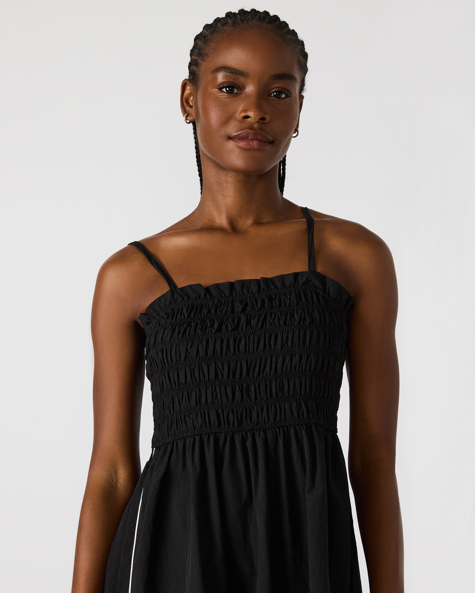 Side view of the flowy maxi dress with stripe detailing.