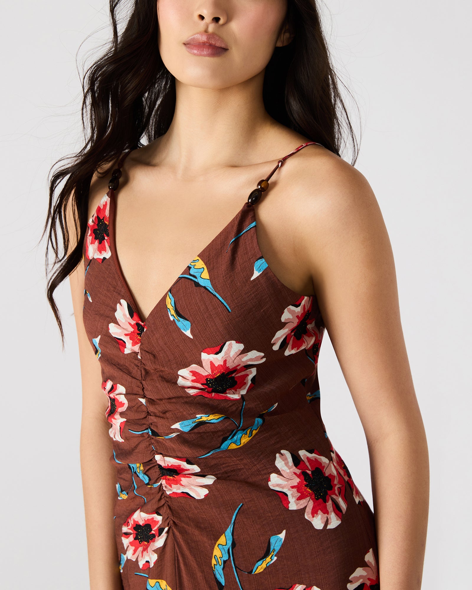 Model in a pink floral maxi dress, perfect for summer events.