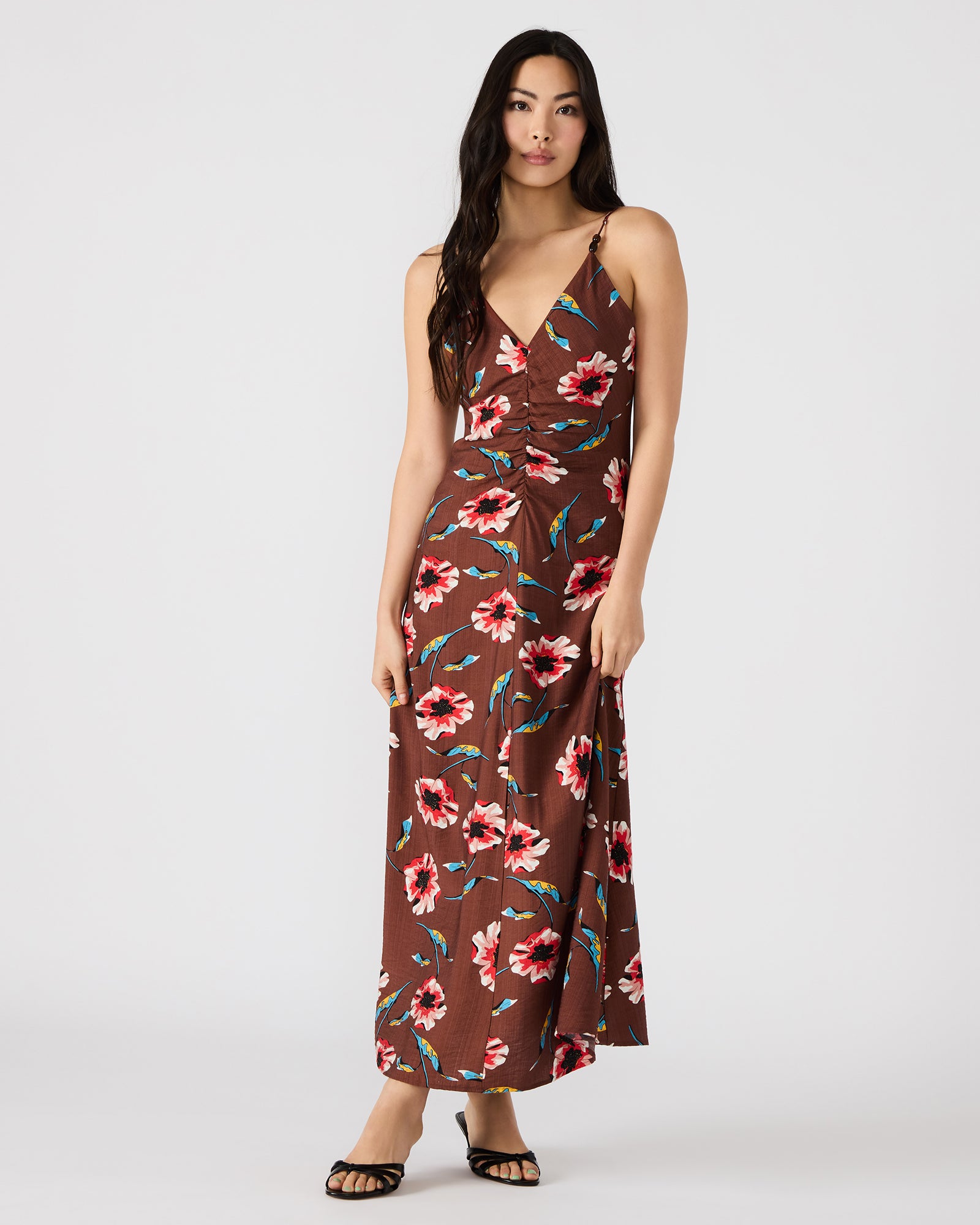 Model in a pink floral maxi dress, perfect for summer events.