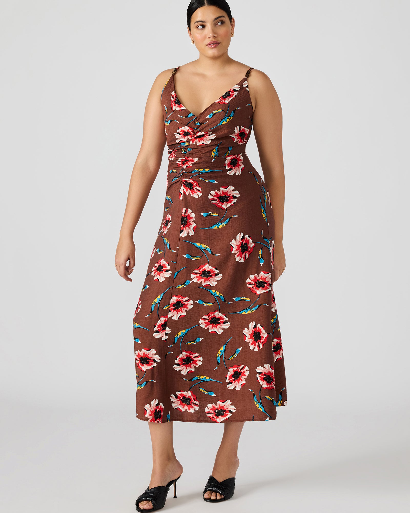 Back view of the brown long sleeve maxi dress highlighting the zipper closure.