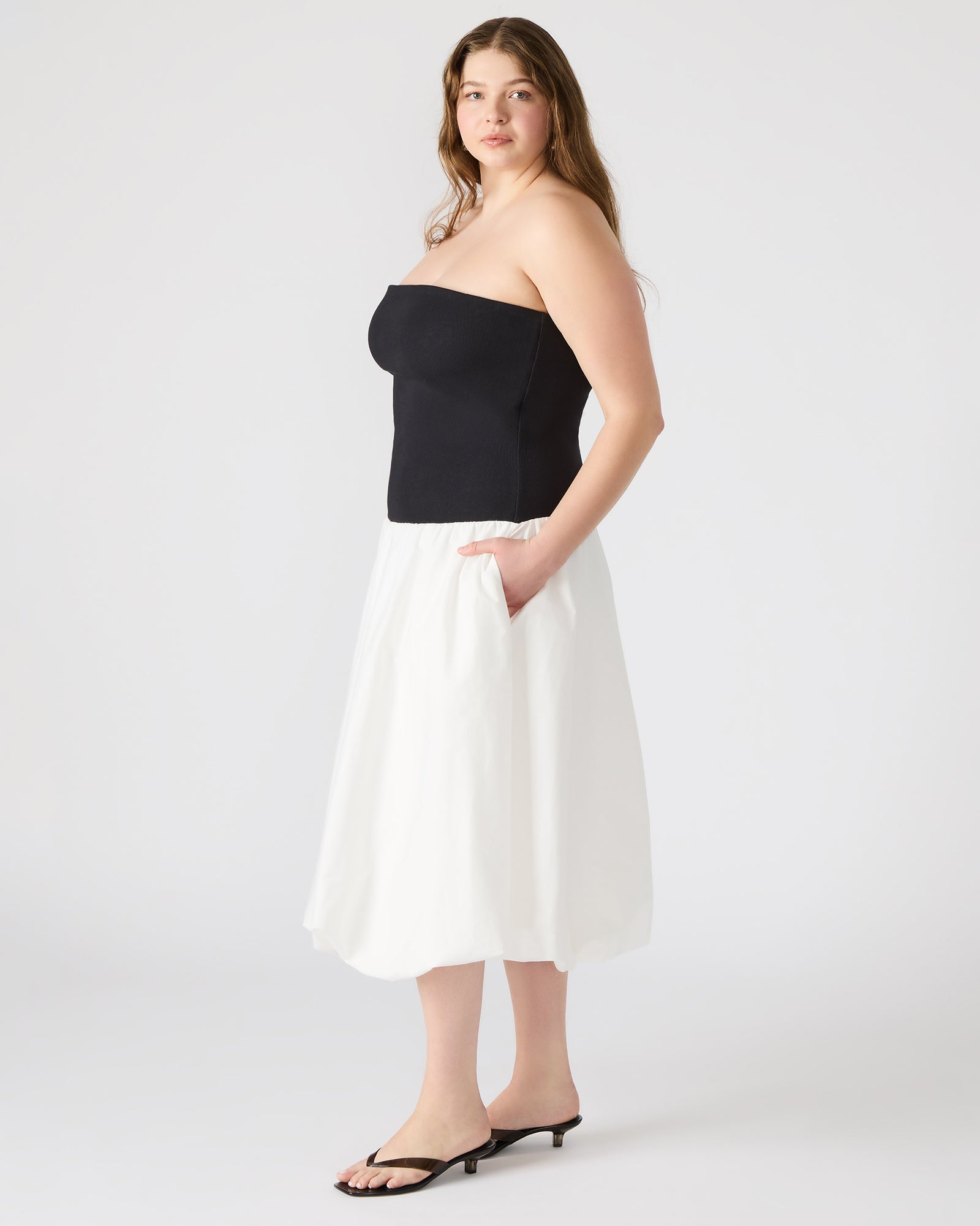 Back detail of the elegant dress, worn with heels for styling inspiration