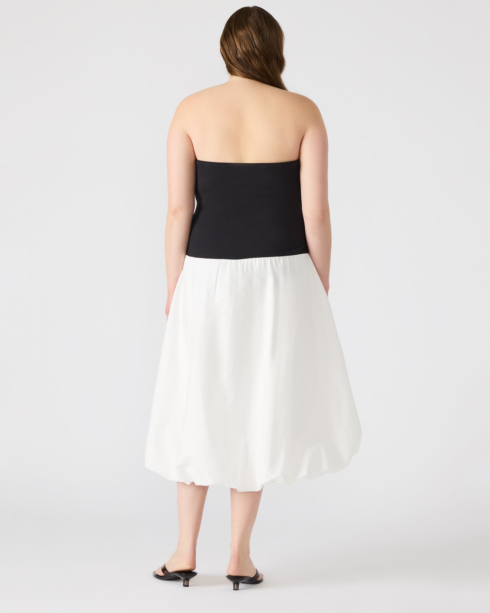 Oliver black strapless dress front view, showcasing the bubble skirt