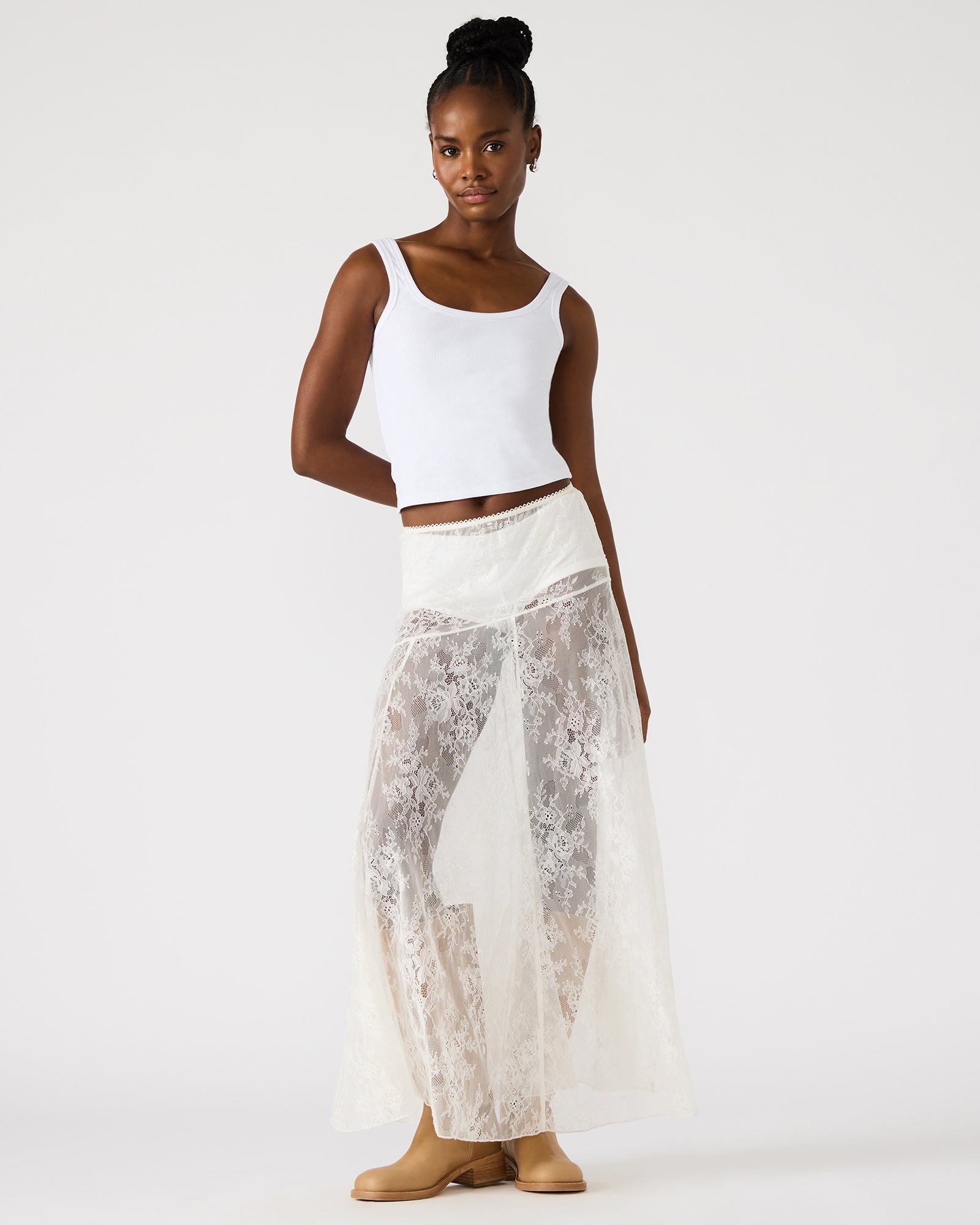 Front view of the Veera white lace maxi skirt on a model.