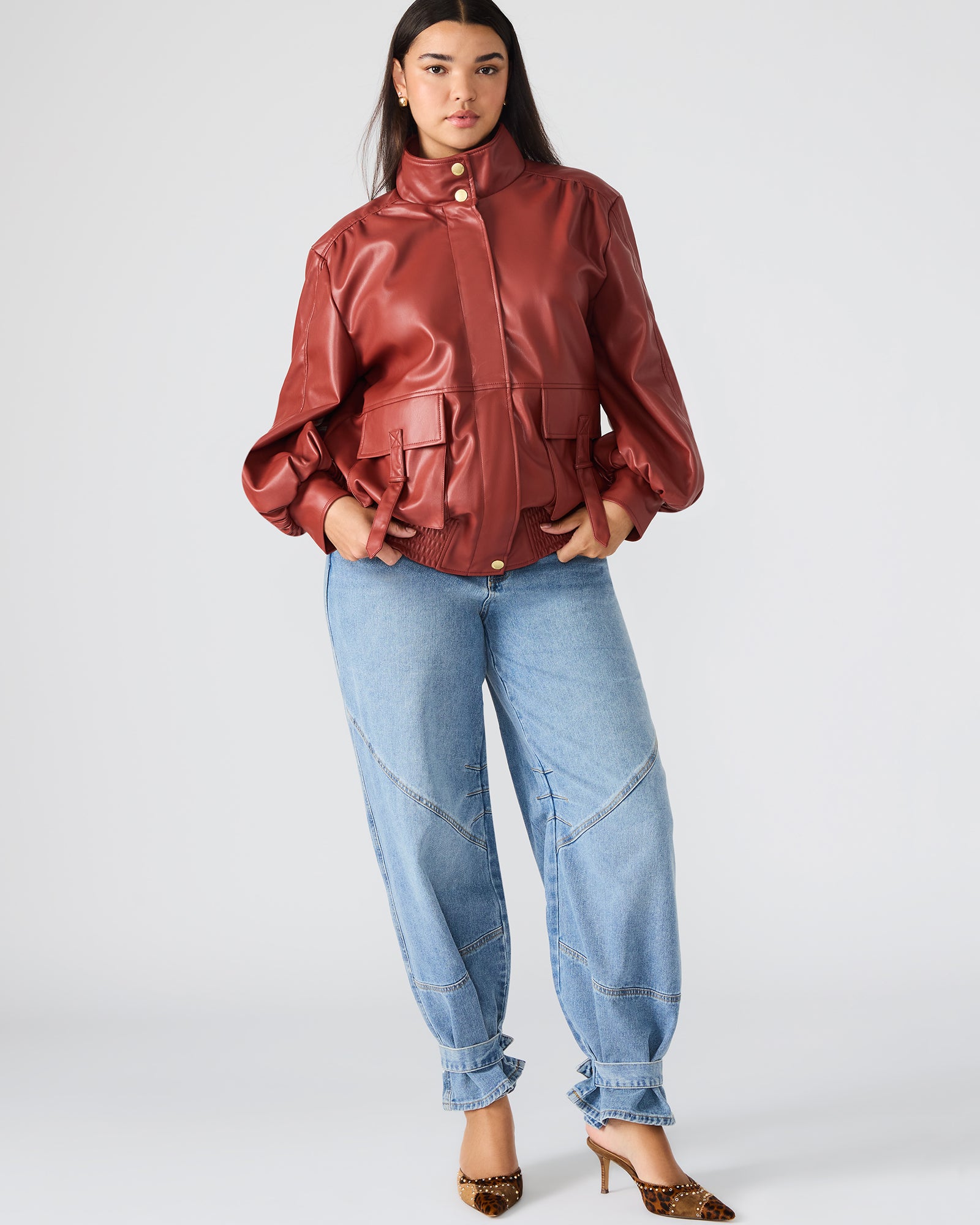 Front view of the Dusty Brick Faux Bomber Leather Jacket on a model.