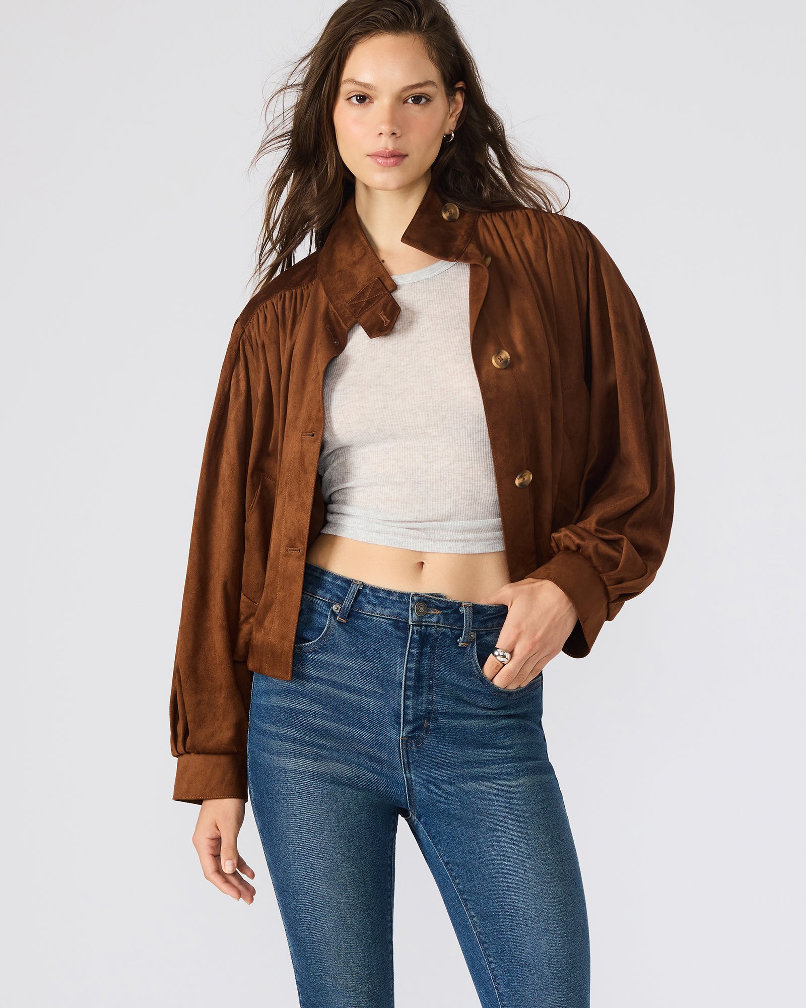 Front view of the chicory coffee faux suede bomber jacket on a model, showcasing its stylish design.