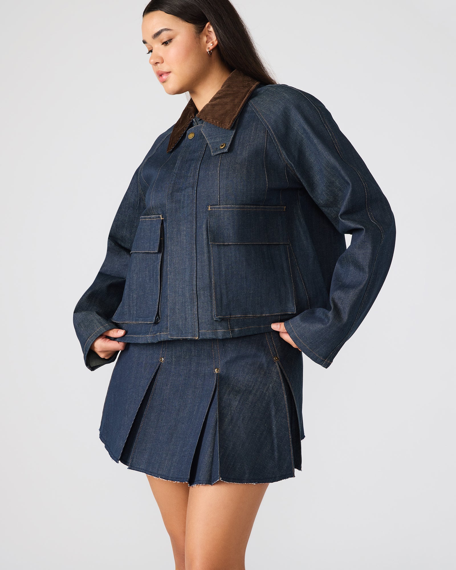 Lifestyle shot of a model wearing the denim jacket, styled for a casual day out.