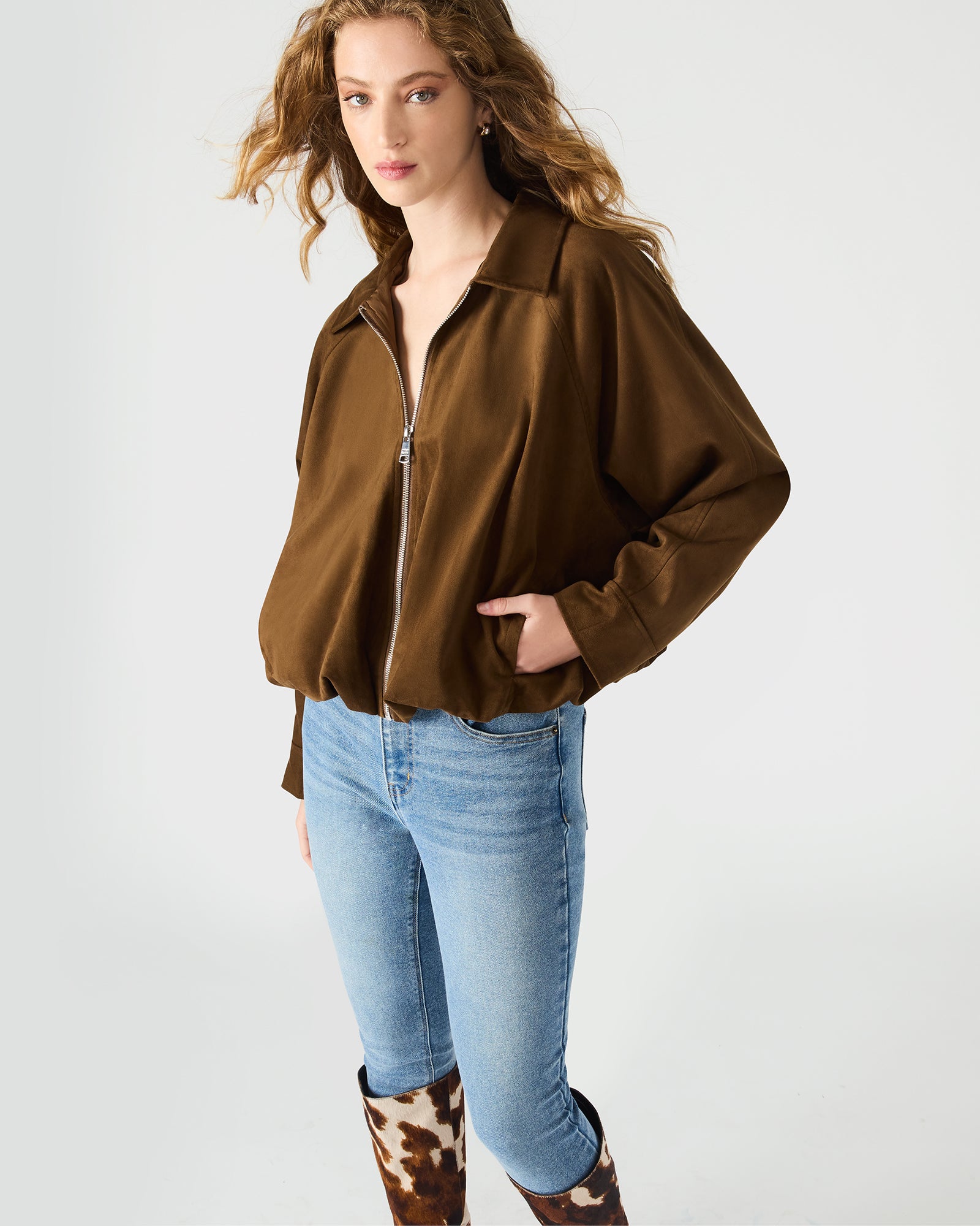 Front view of chestnut zip-up jacket styled with fall accessories