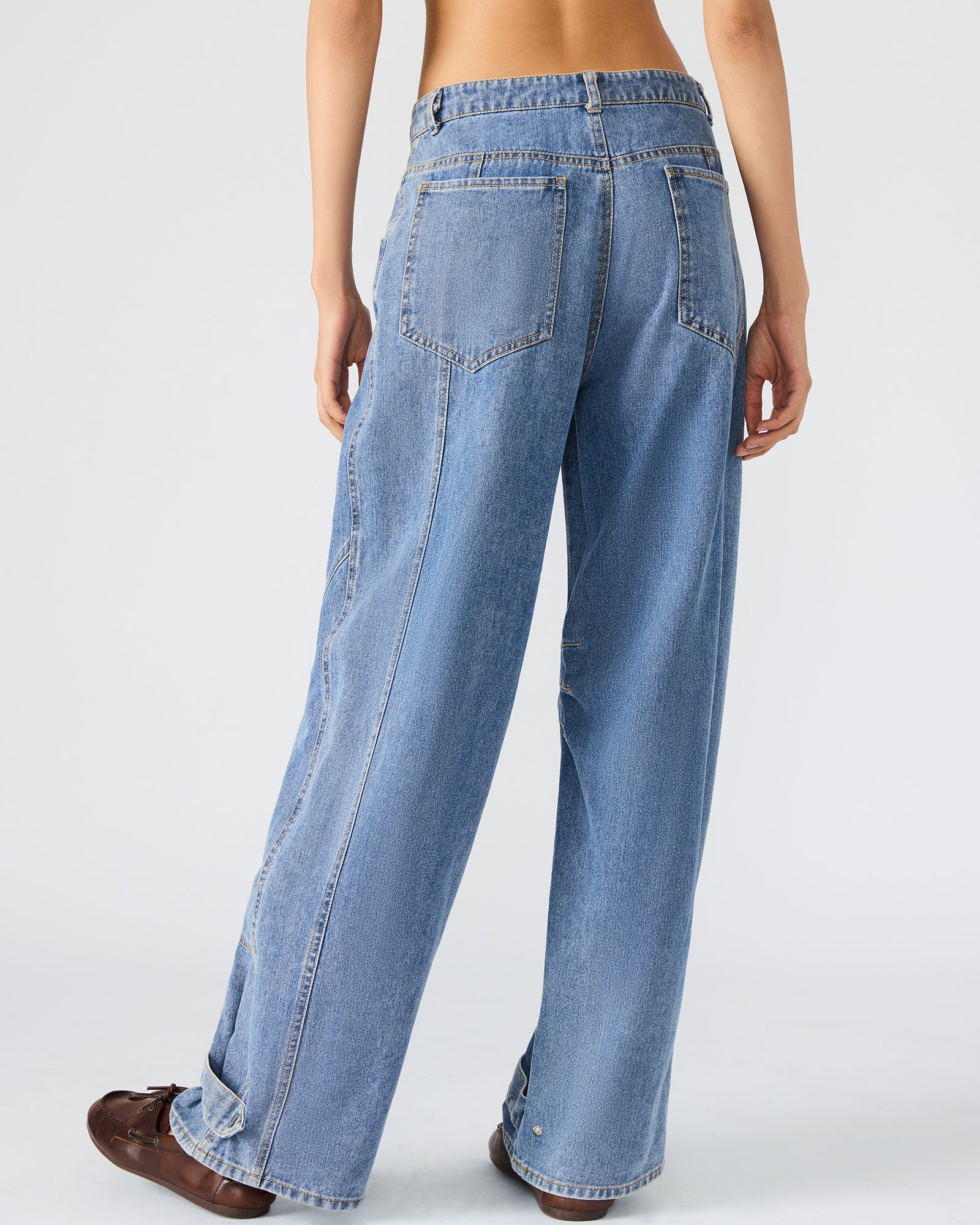 Front view of Forever Blue low rise jeans showcasing pockets.