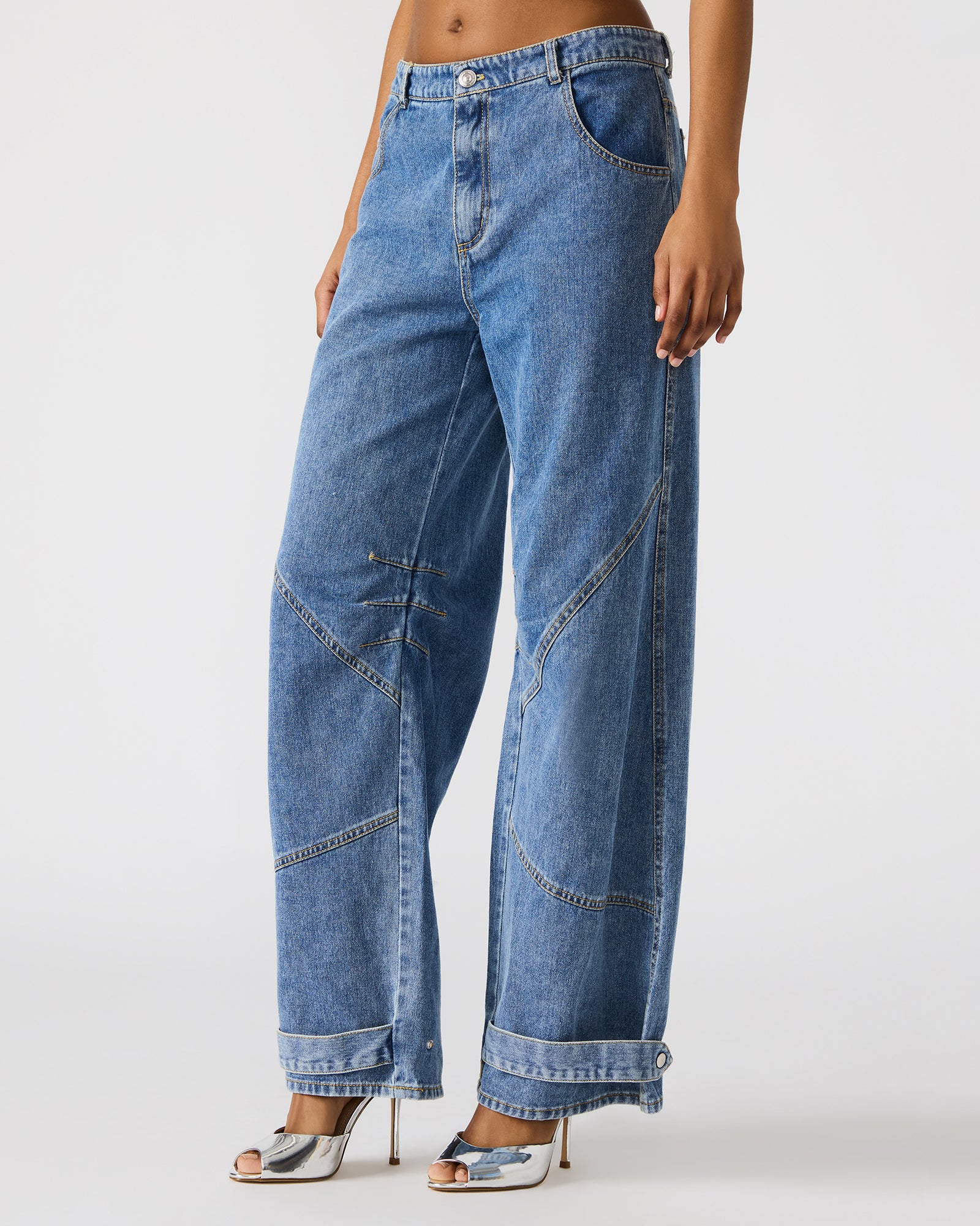 Back view of barrel leg jeans highlighting the flattering pocket placement.