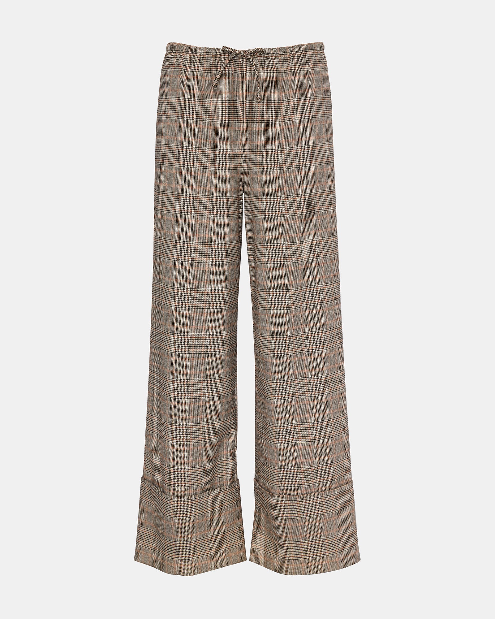 Side view of women’s plaid pants with cuffed hem and functional pockets