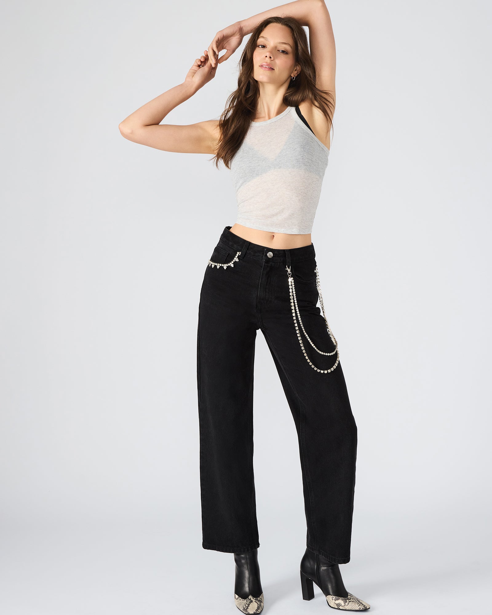 Front view of Swift wide-leg denim jeans with chain detail.