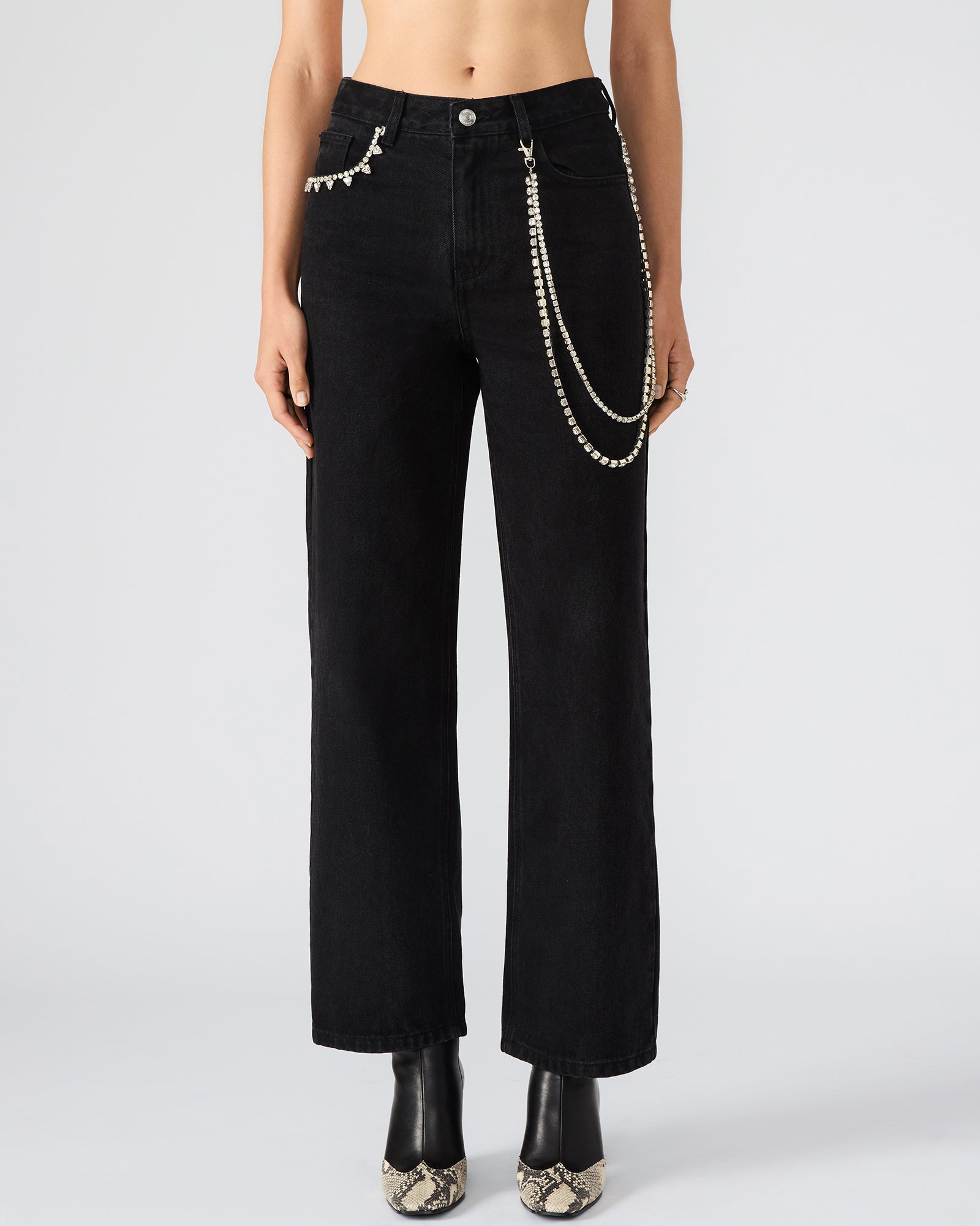 Side view of black wide-leg jeans, showcasing pockets and fit.