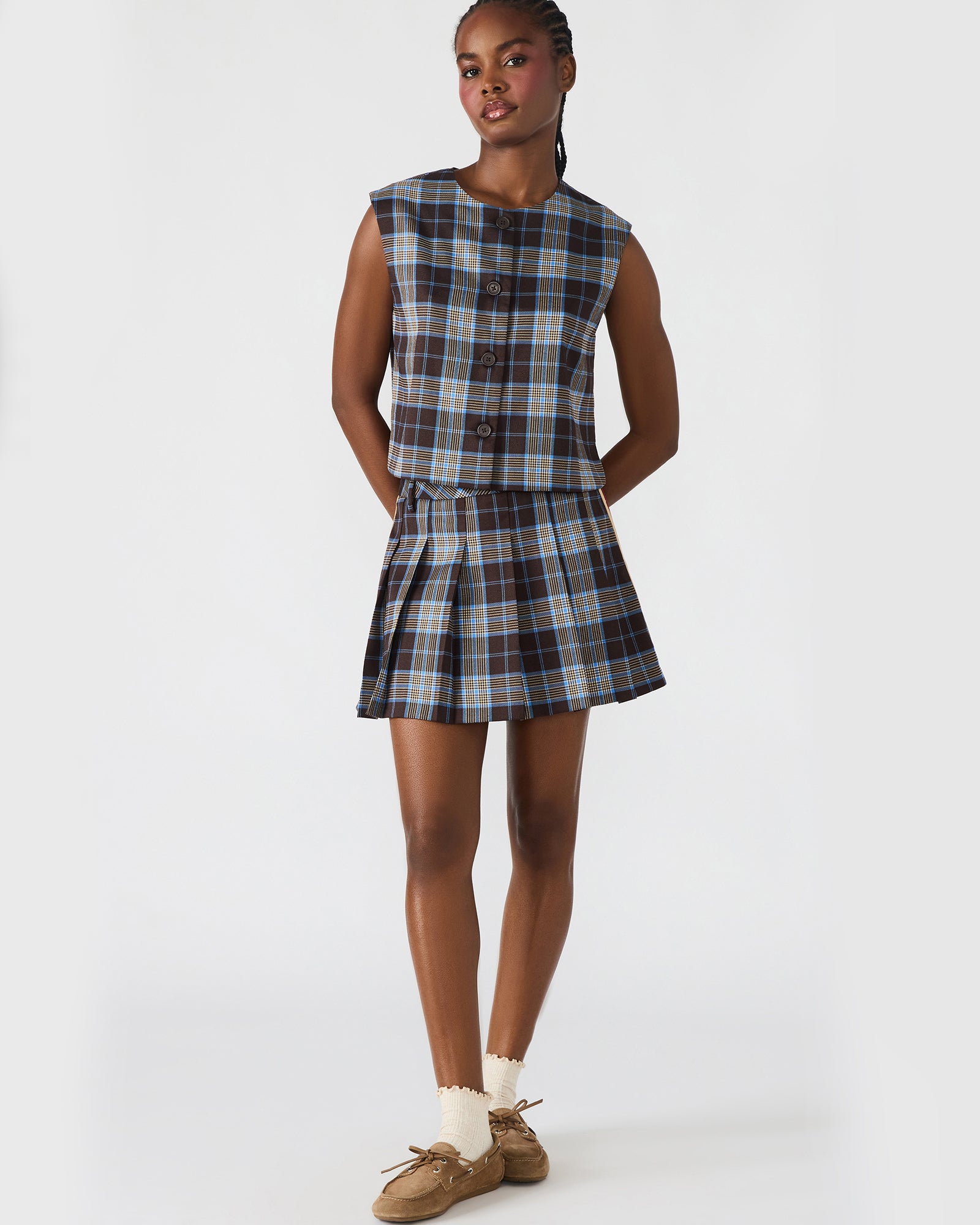Close-up of the Alessa plaid top collar and buttons, showcasing its button-up shirt details