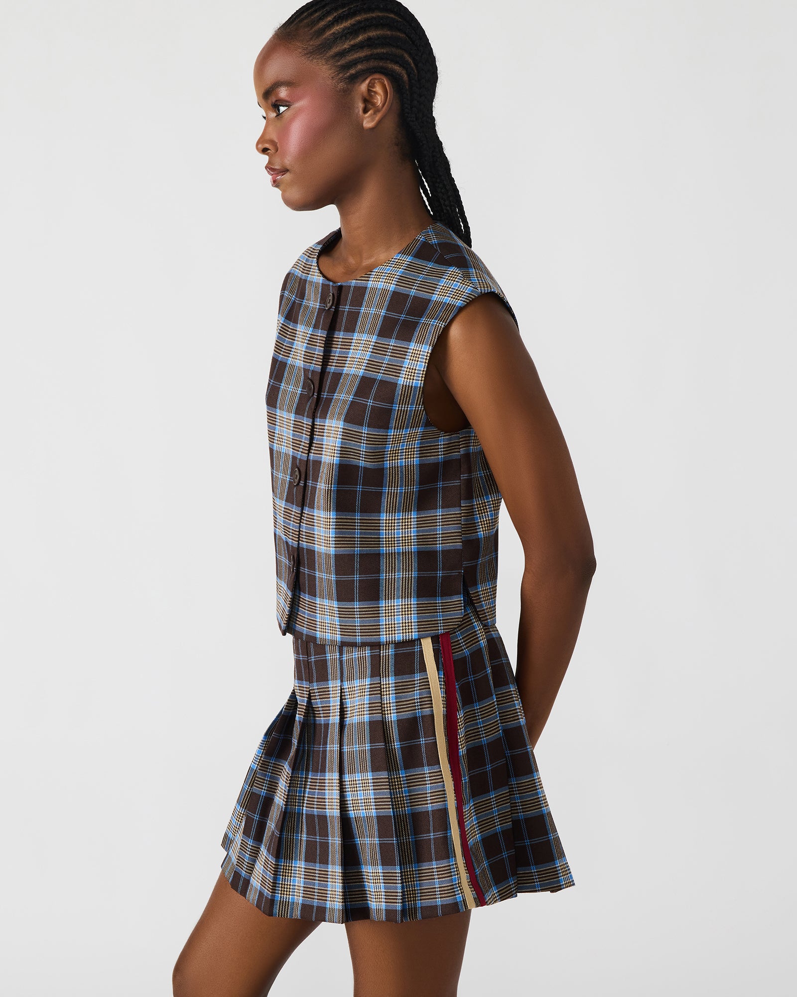 Close-up of the Alessa plaid top collar and buttons, showcasing its button-up shirt details