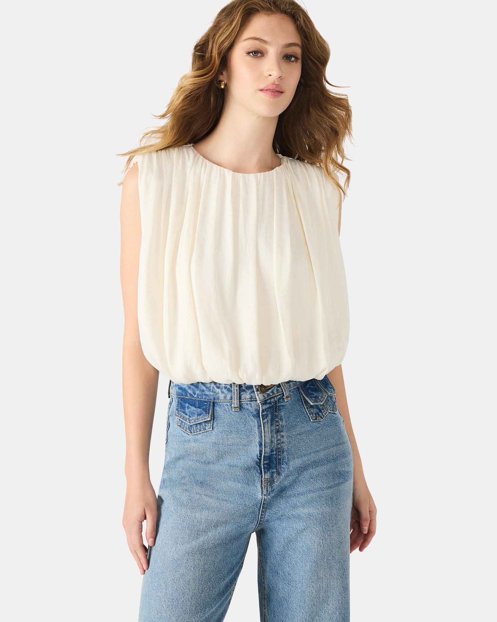 Model pairing the boho hippie top with denim for a casual outdoor look