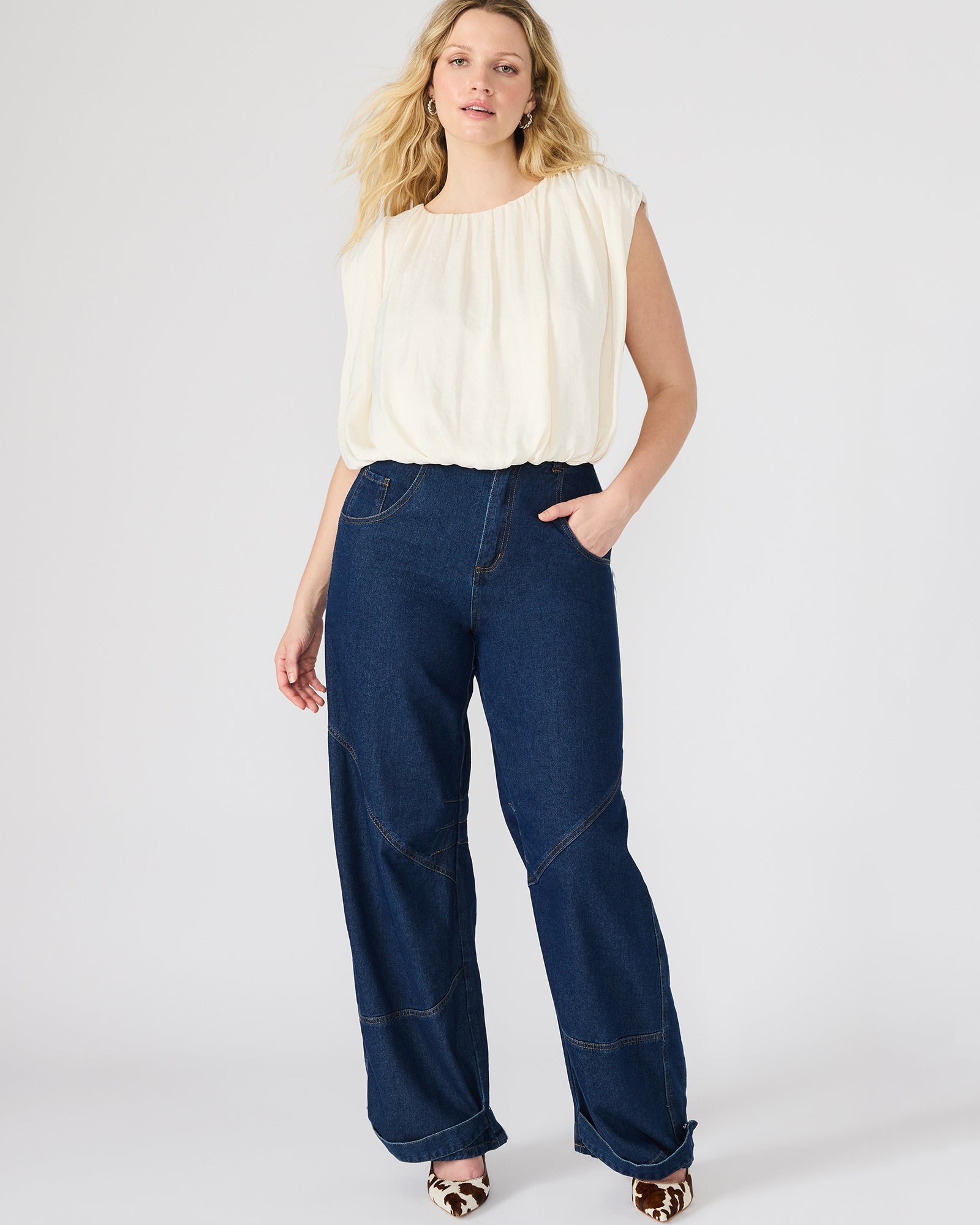 Model pairing the boho hippie top with denim for a casual outdoor look