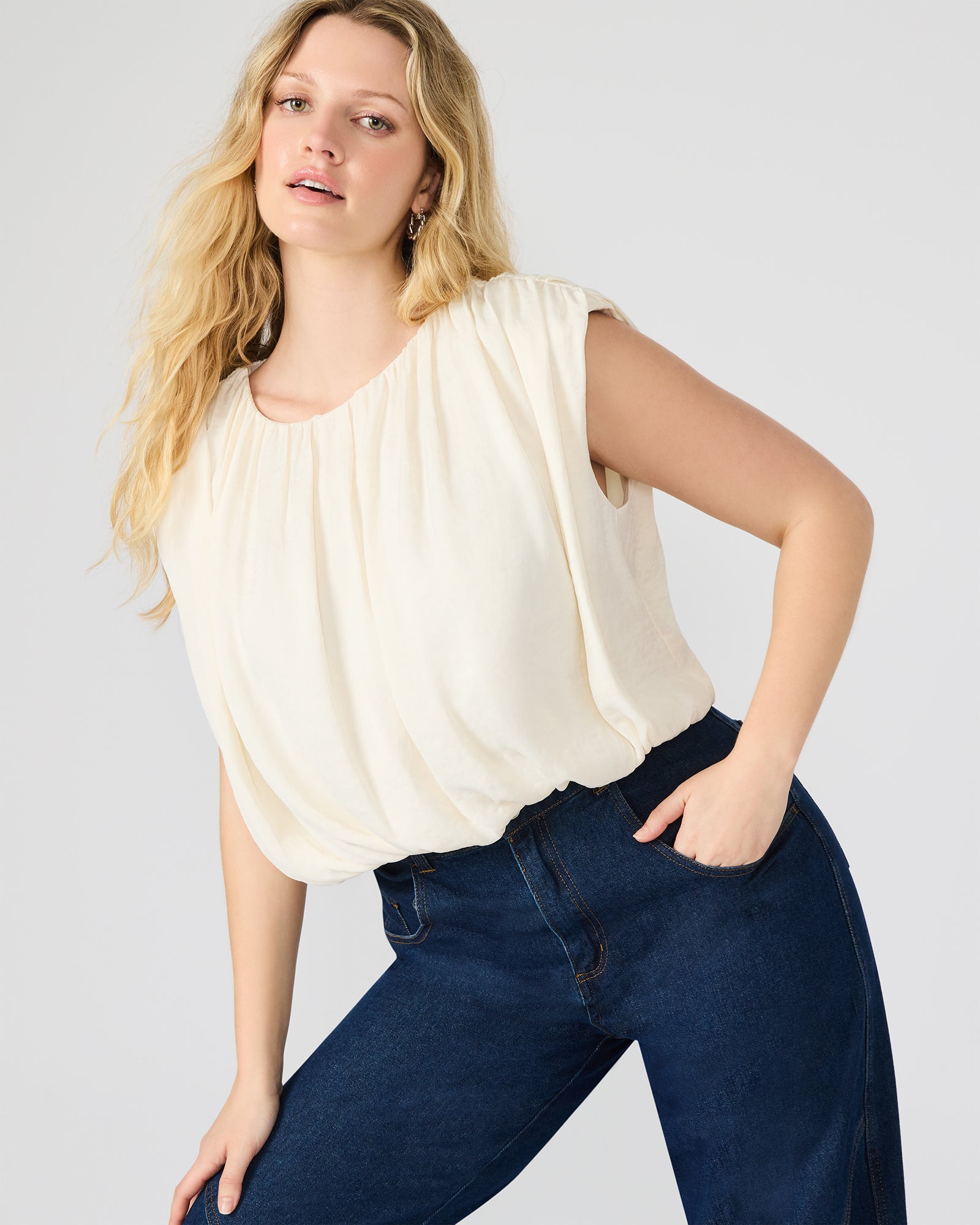 Close-up of the Milana top showing pleated and bubble silhouette details