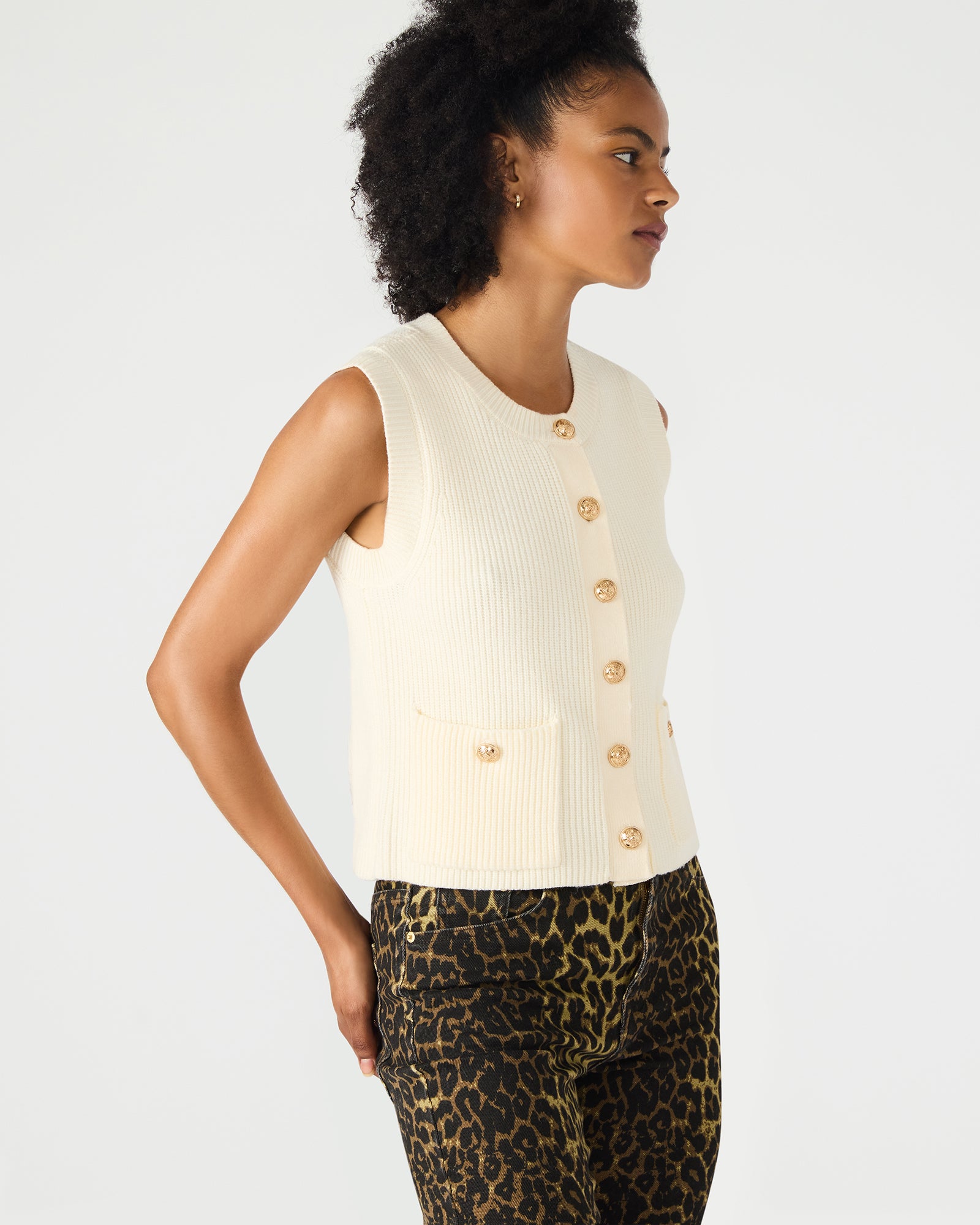 Side angle showcasing tailored fit and pockets on this womens vest