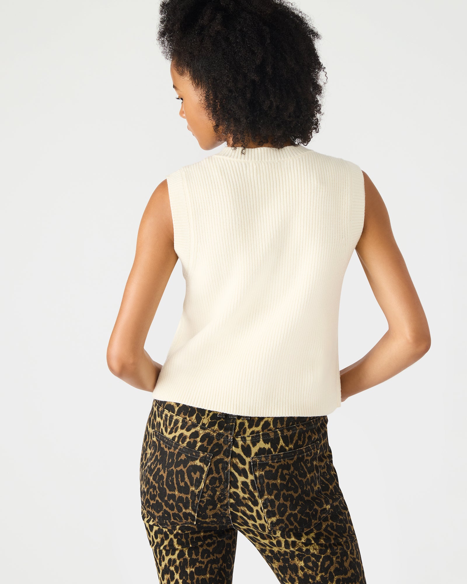 Detail shot of gold buttons and texture on the womens heated vest