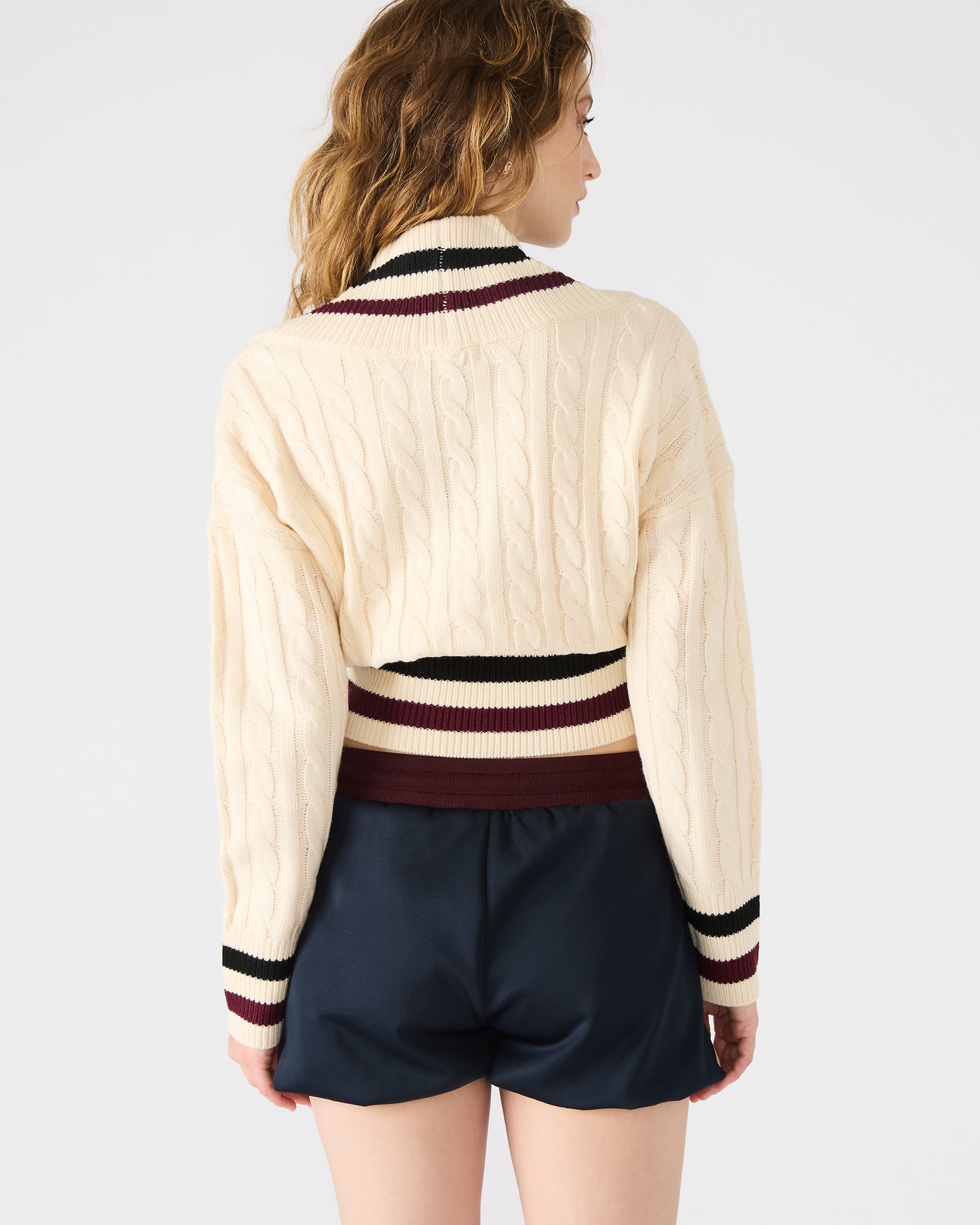 Addison cream sweater draped off-shoulder for a relaxed look