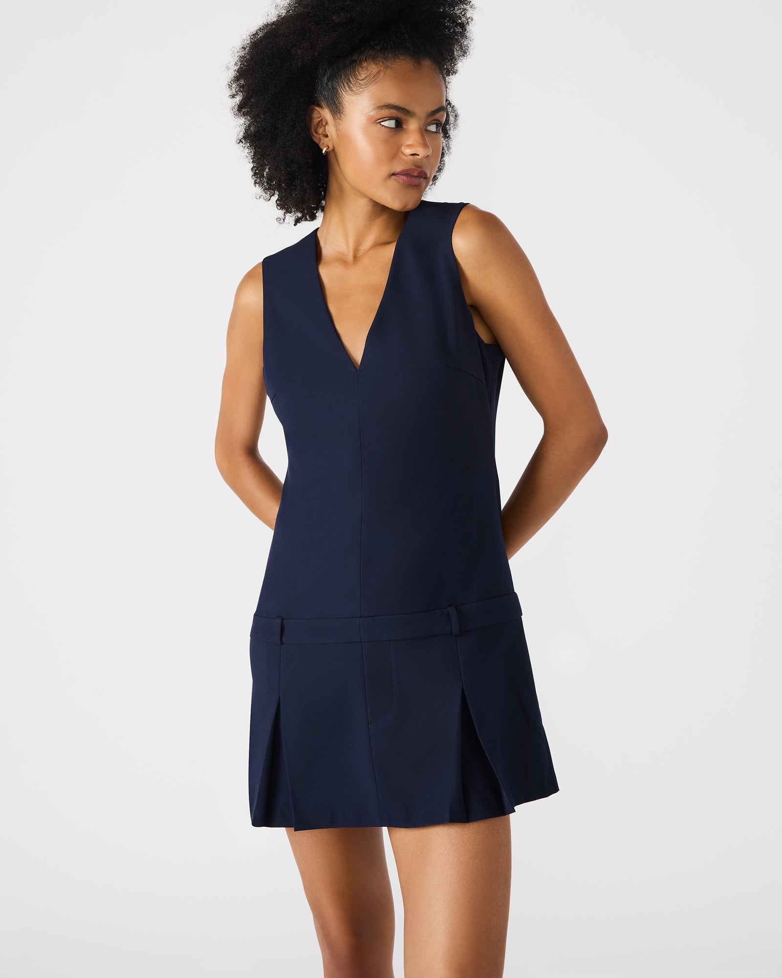 Back view showcasing the zipper closure of the V-neck mini dress.