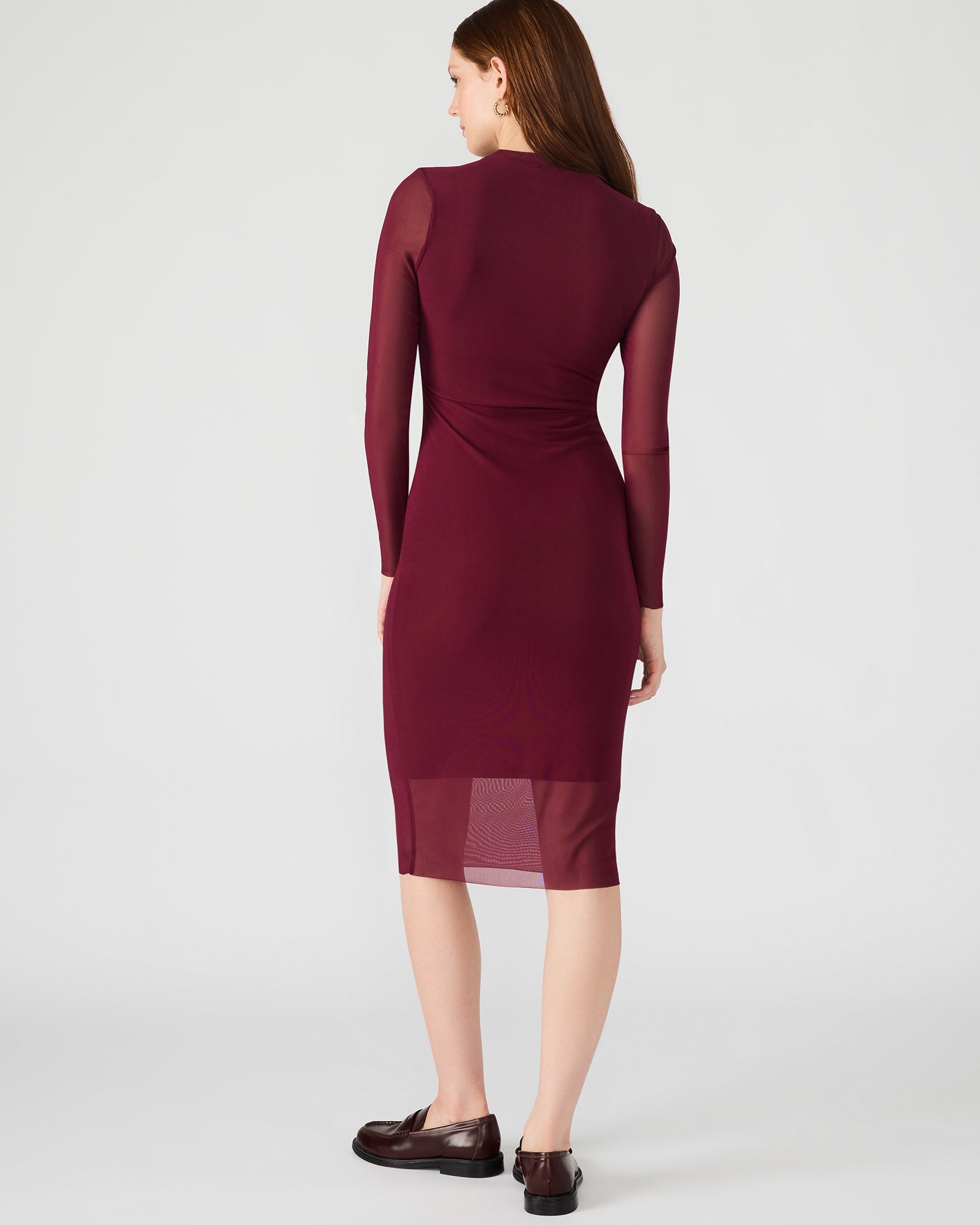 Back view of the mock neck and long sleeves for evening elegance