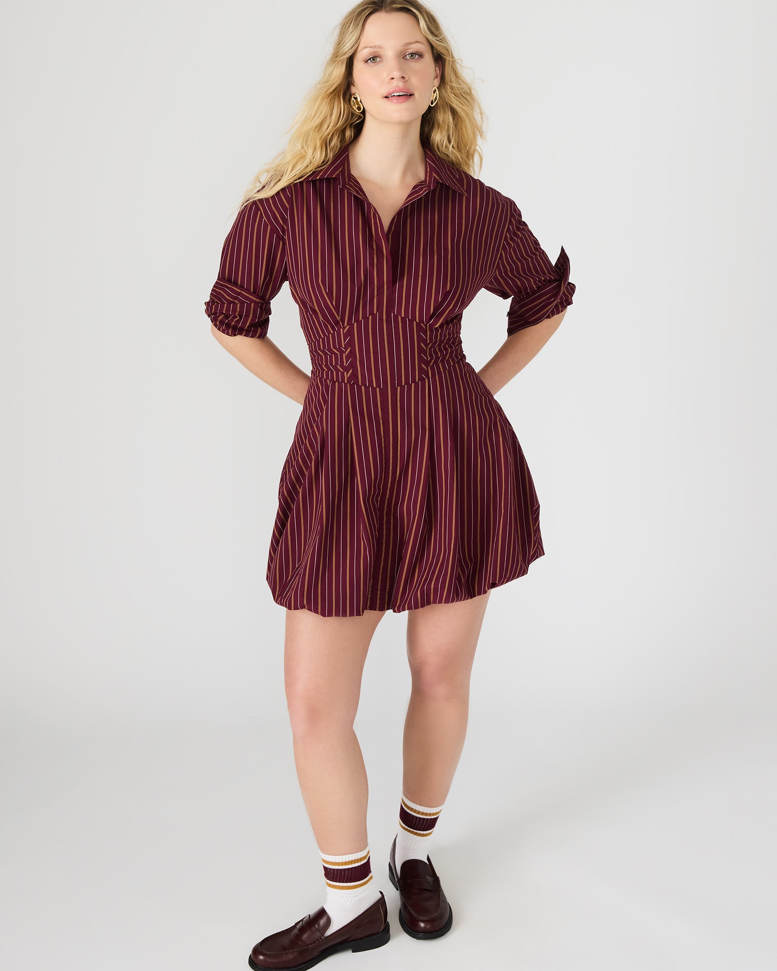 Front view of the long sleeve black mini dress in wine color.