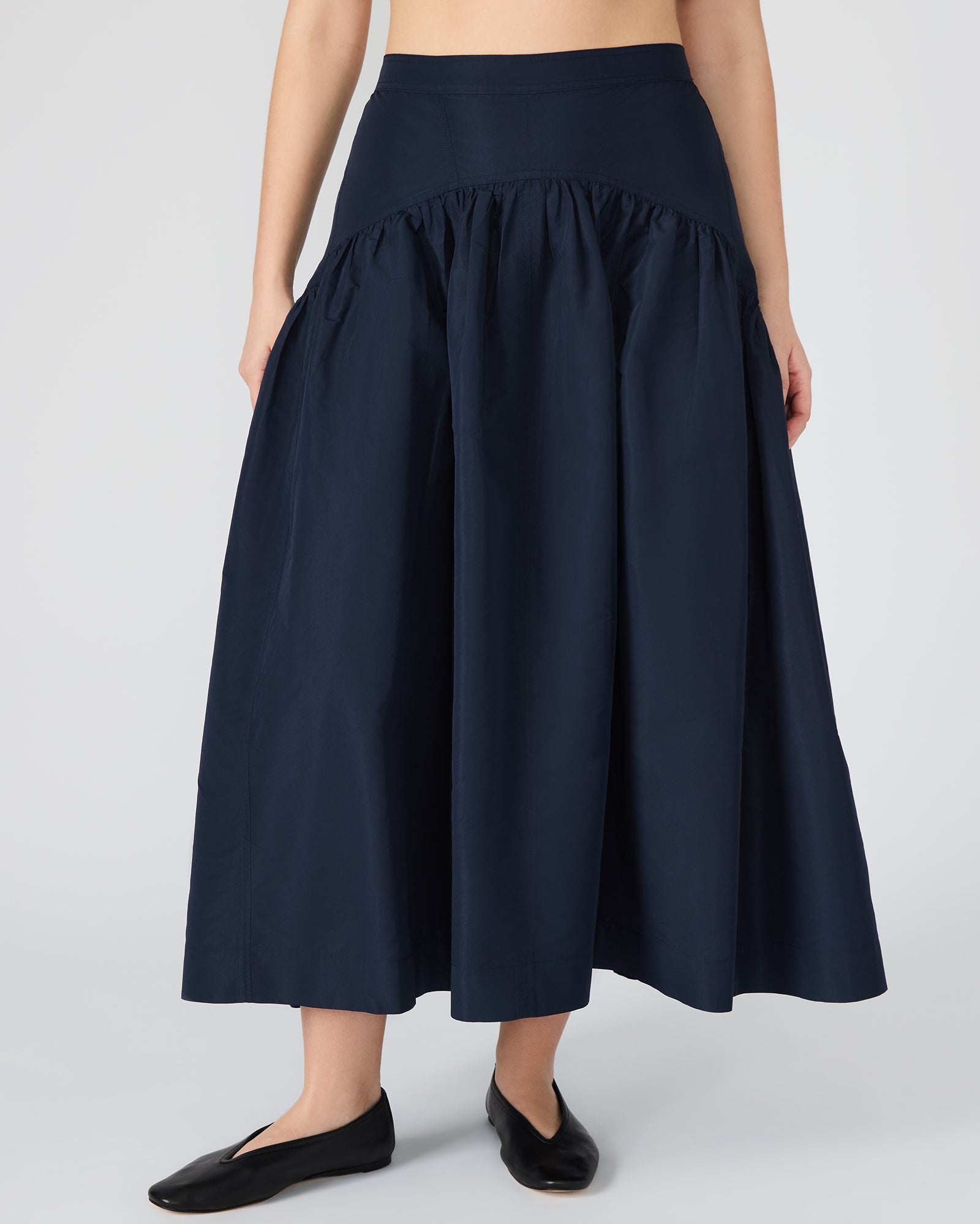 Elegant skirt paired with white blouse for evening wear