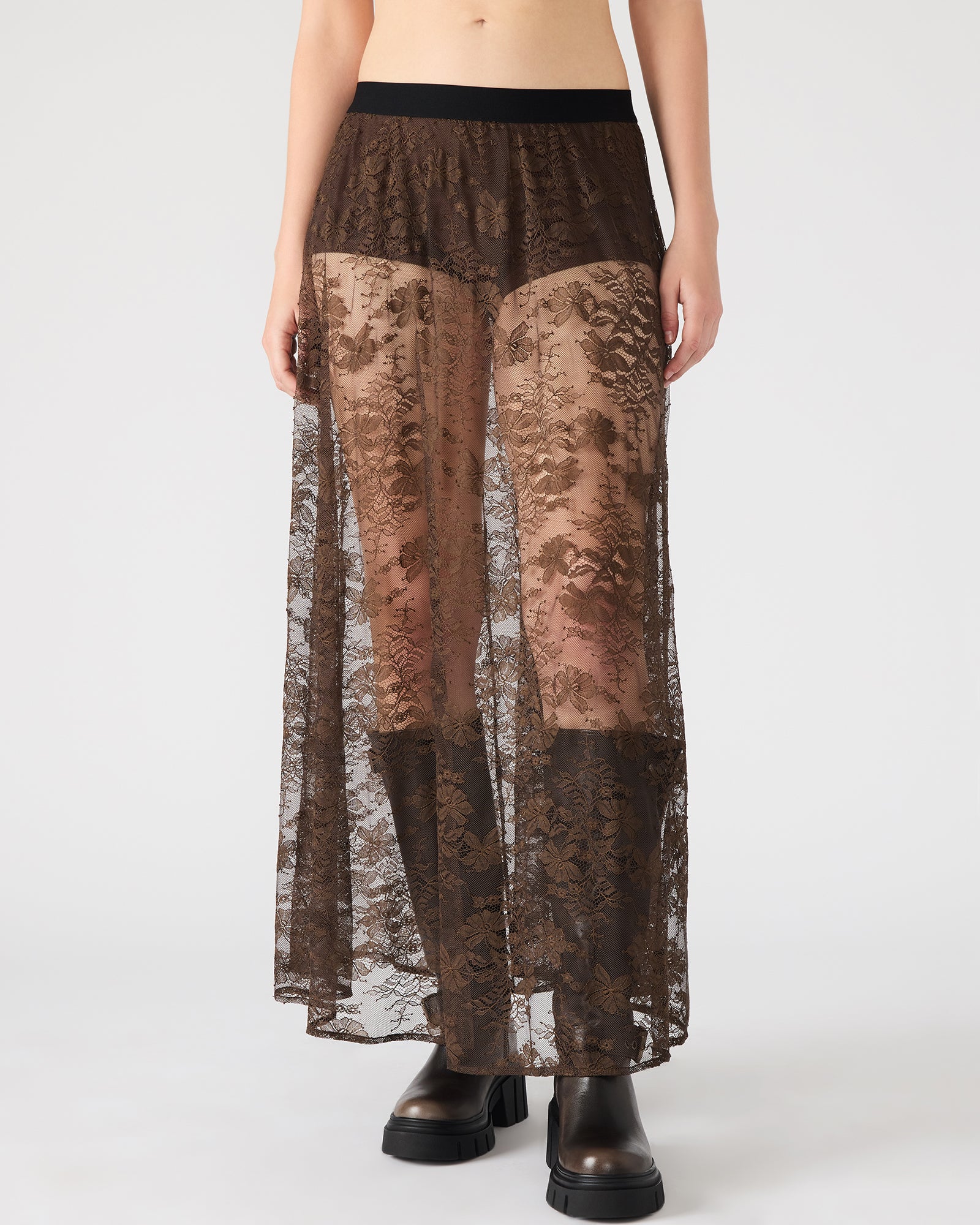 Side view of the sheer lace maxi skirt, highlighting its elegant flow and design.