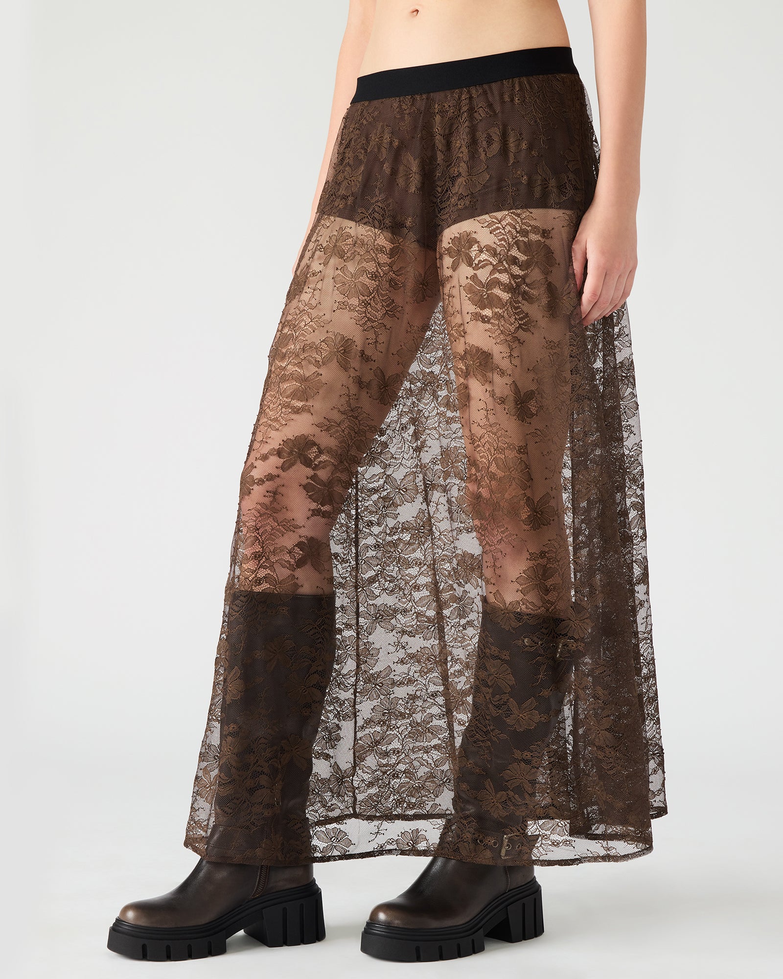 Close-up of the lace detailing on the dark espresso maxi skirt, emphasizing its texture.