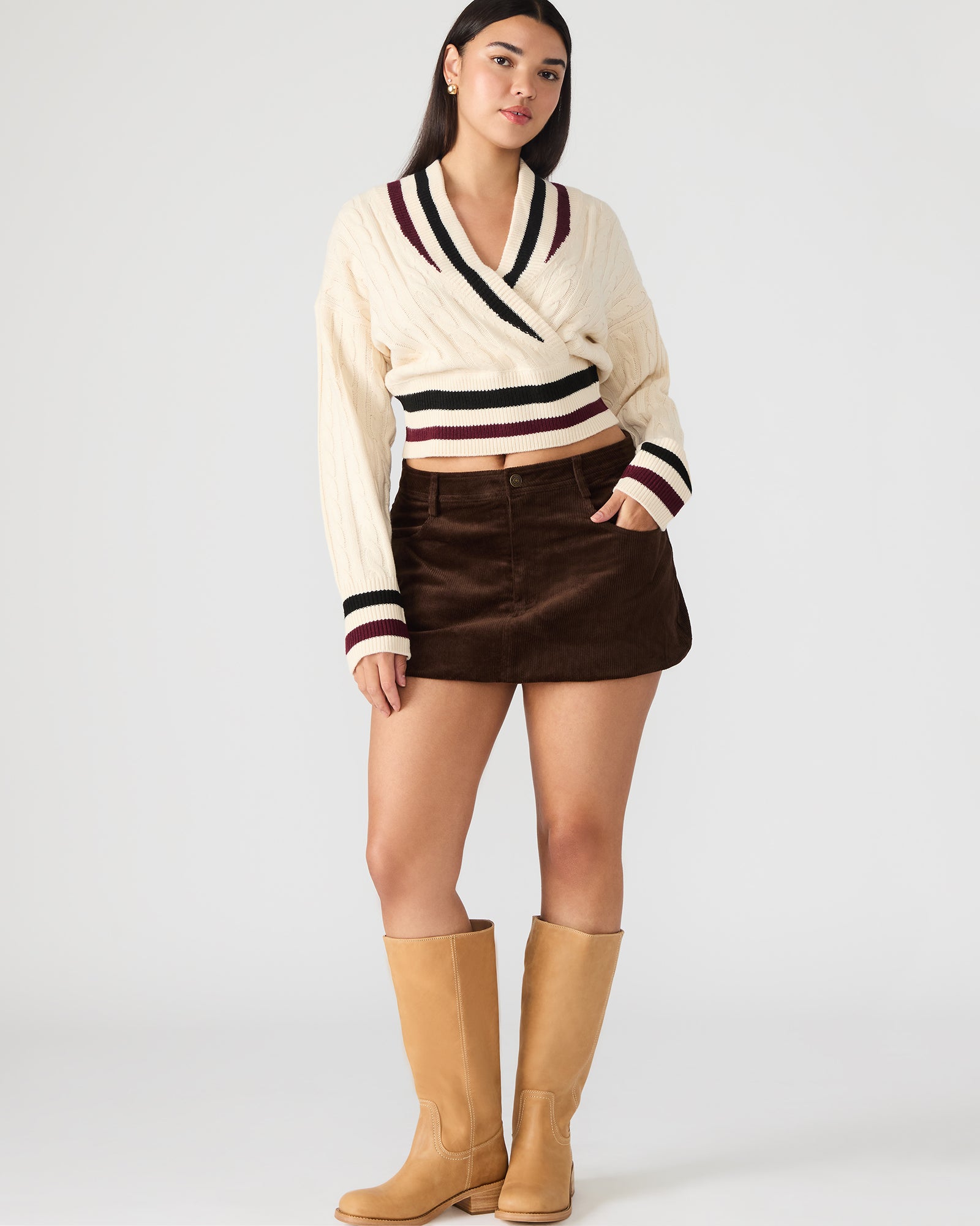 Front view of the dark espresso leather mini skirt with zipper and pockets