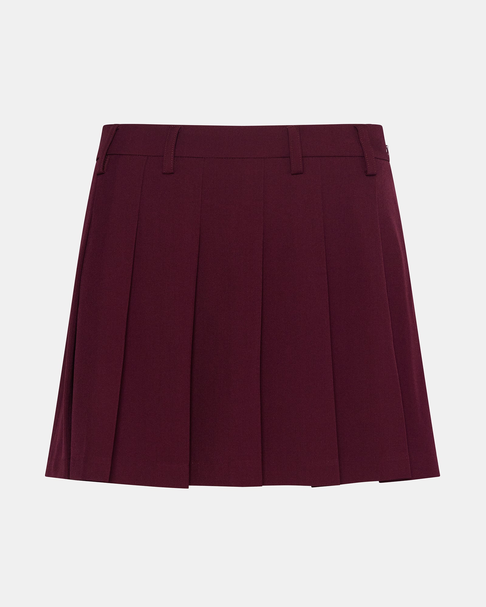 Close-up of pleated detail on wine mini skirt with natural lighting