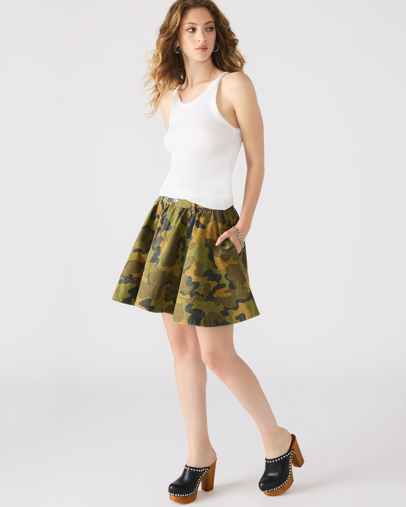 Side view showcasing the flattering fit of the Sloan denim skirt.